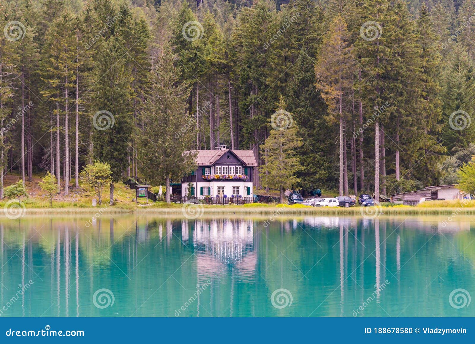 White Lake House in the Deep Forest on the Lake Shore Stock Photo