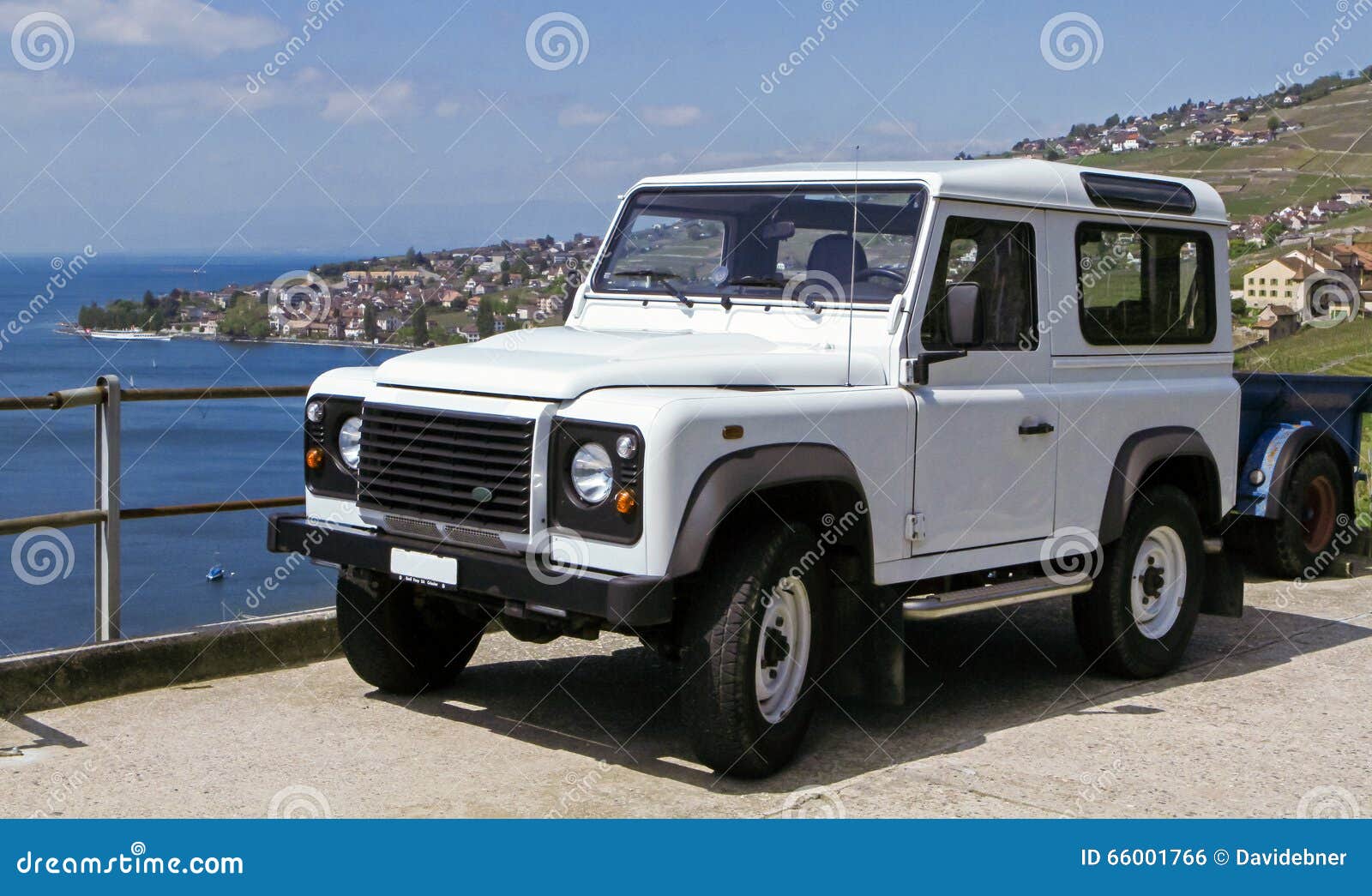 white land rover defender on holiday