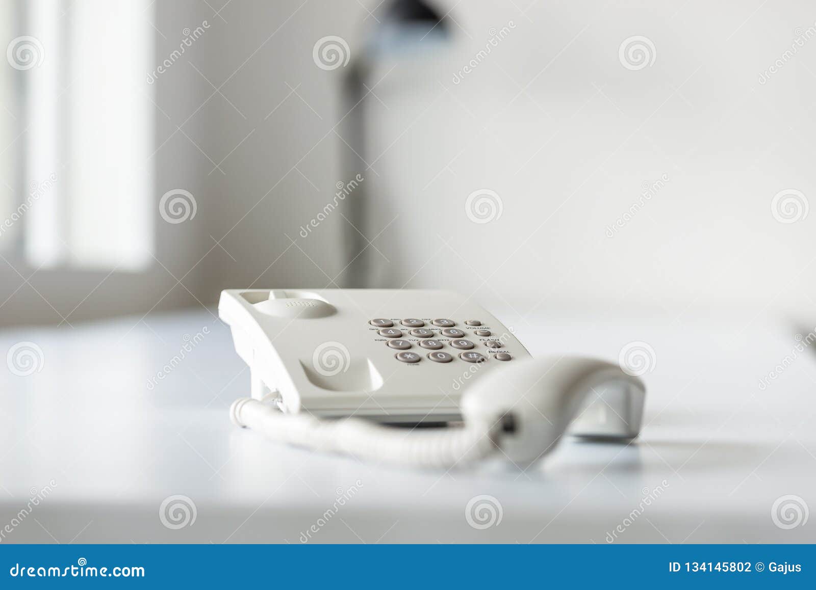 white landline telephone with handset off line