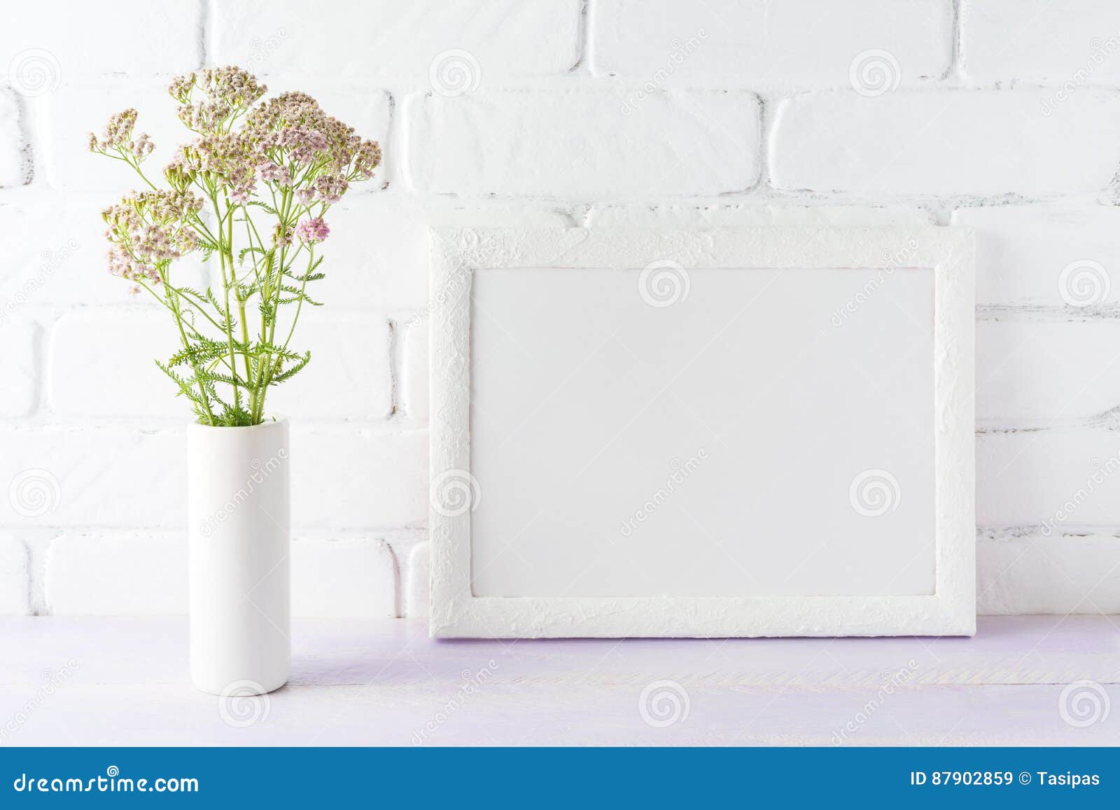 https://thumbs.dreamstime.com/z/white-landscape-frame-mockup-creamy-pink-flowers-cylinder-vas-vase-near-painted-brick-wall-empty-mock-up-87902859.jpg
