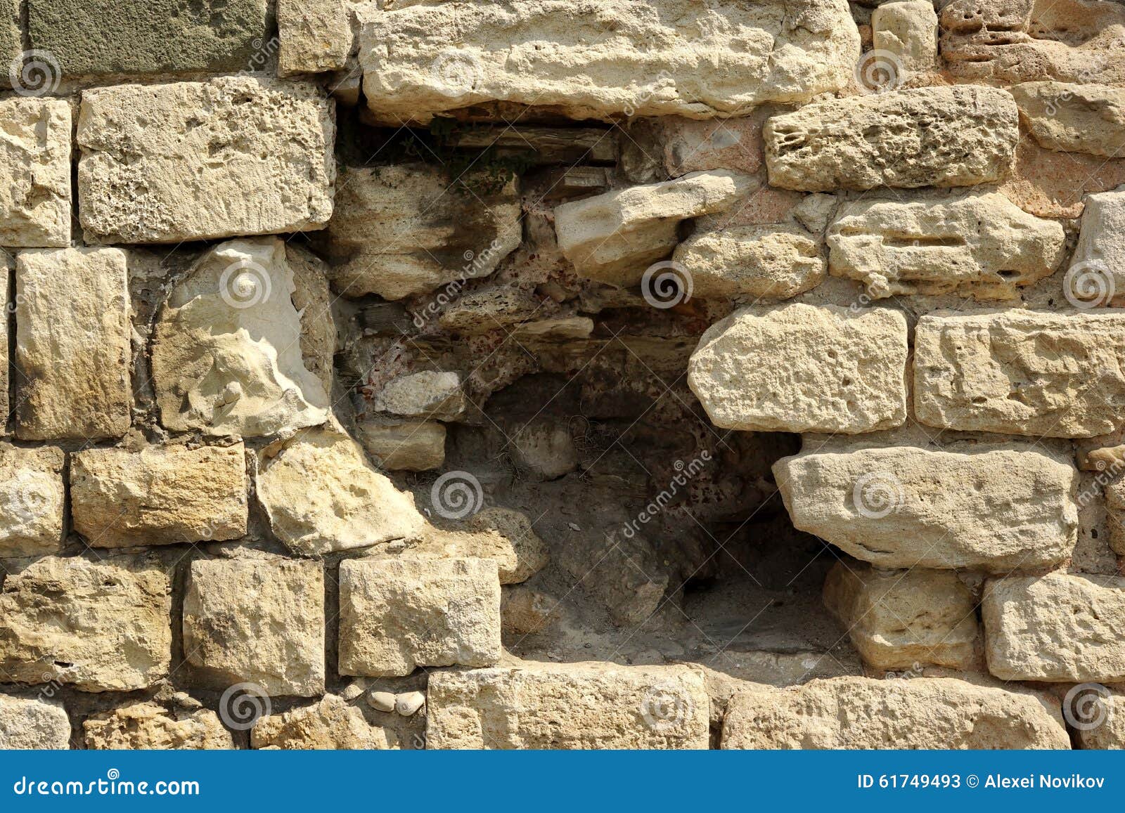 White Limestone Wall With Black Hole Texture Background. White Old Limestone Wall With Large Black Hole Texture Background, Close Up