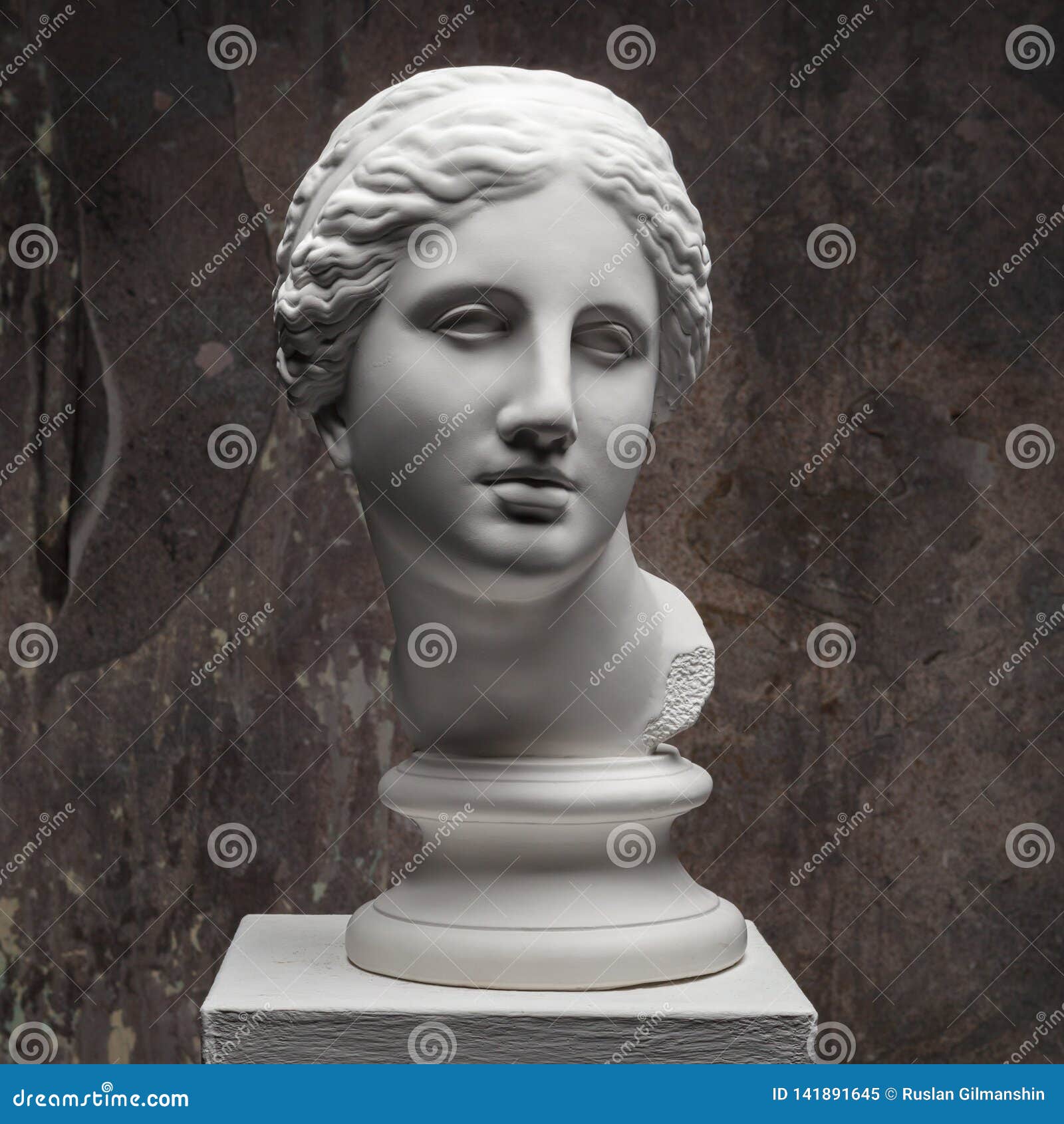 white marble head of young woman. statue art sculpture of stone face. ancient beautiful woman monument