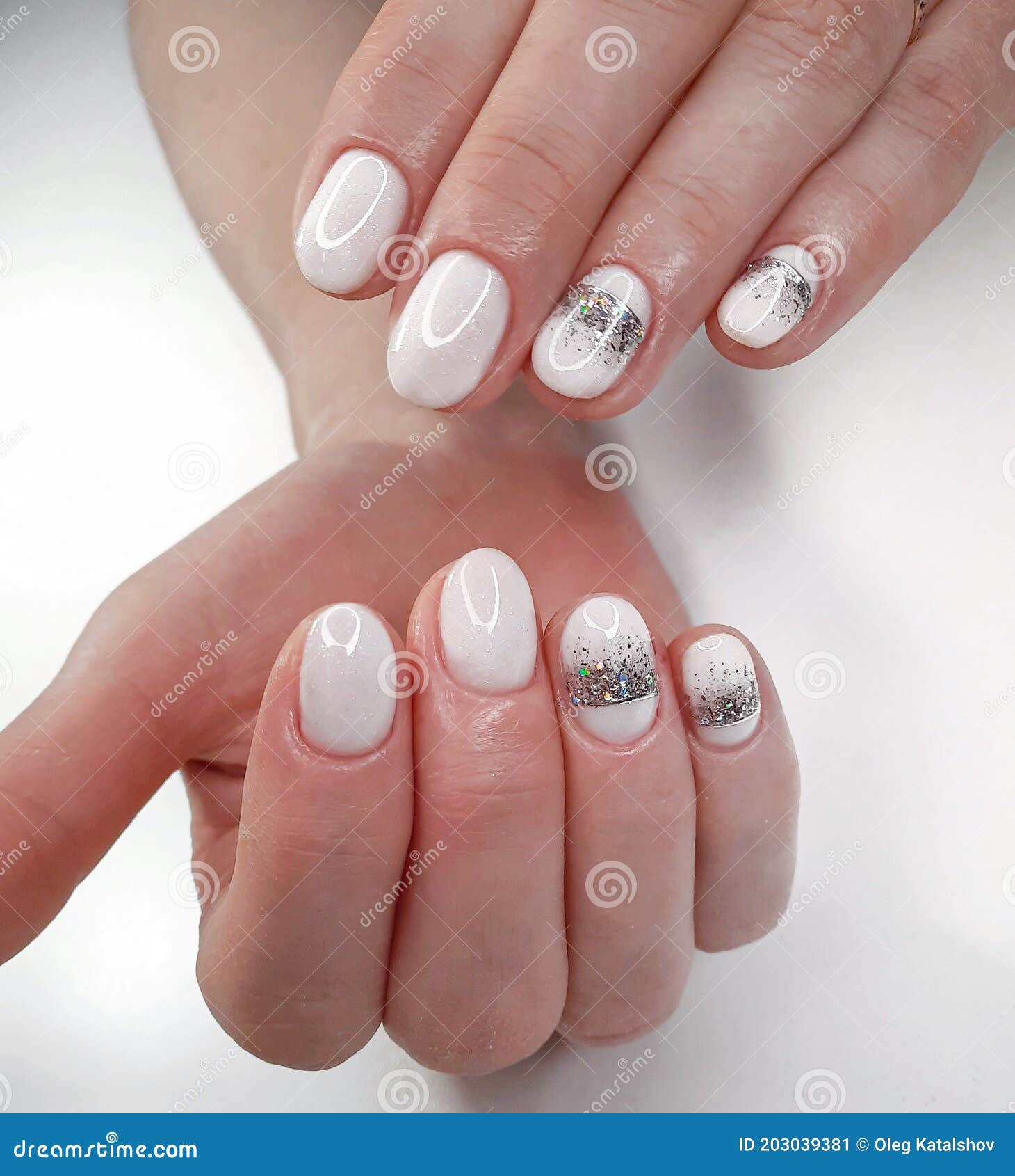 White Nails with Sequins and a Silver Crown Design on a White Background.  White Shiny Gel Polish on Round Short Nails. Stock Image - Image of round,  color: 203039381