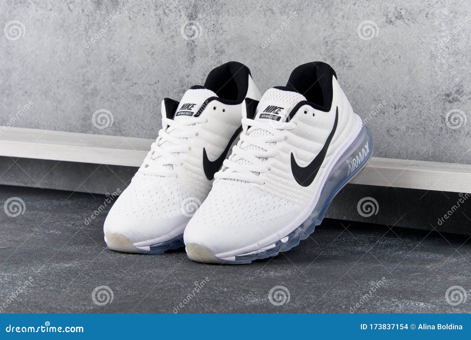 White Nike Air Max 2017 Running Shoes, Sneakers Shot on Grey Abstract Background. Krasnoyarsk, Russia - May 12, 2017 Editorial Stock Image - Image of sneaker,