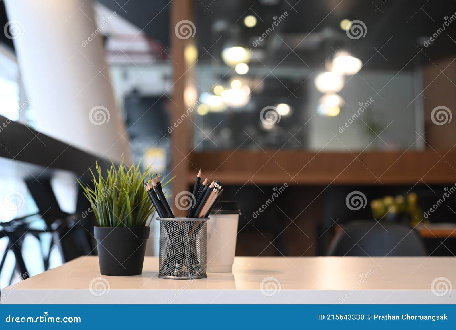 White Office Desk with Pencil Holder, Plant and Coffee Cup at Office. Stock Photo Image of