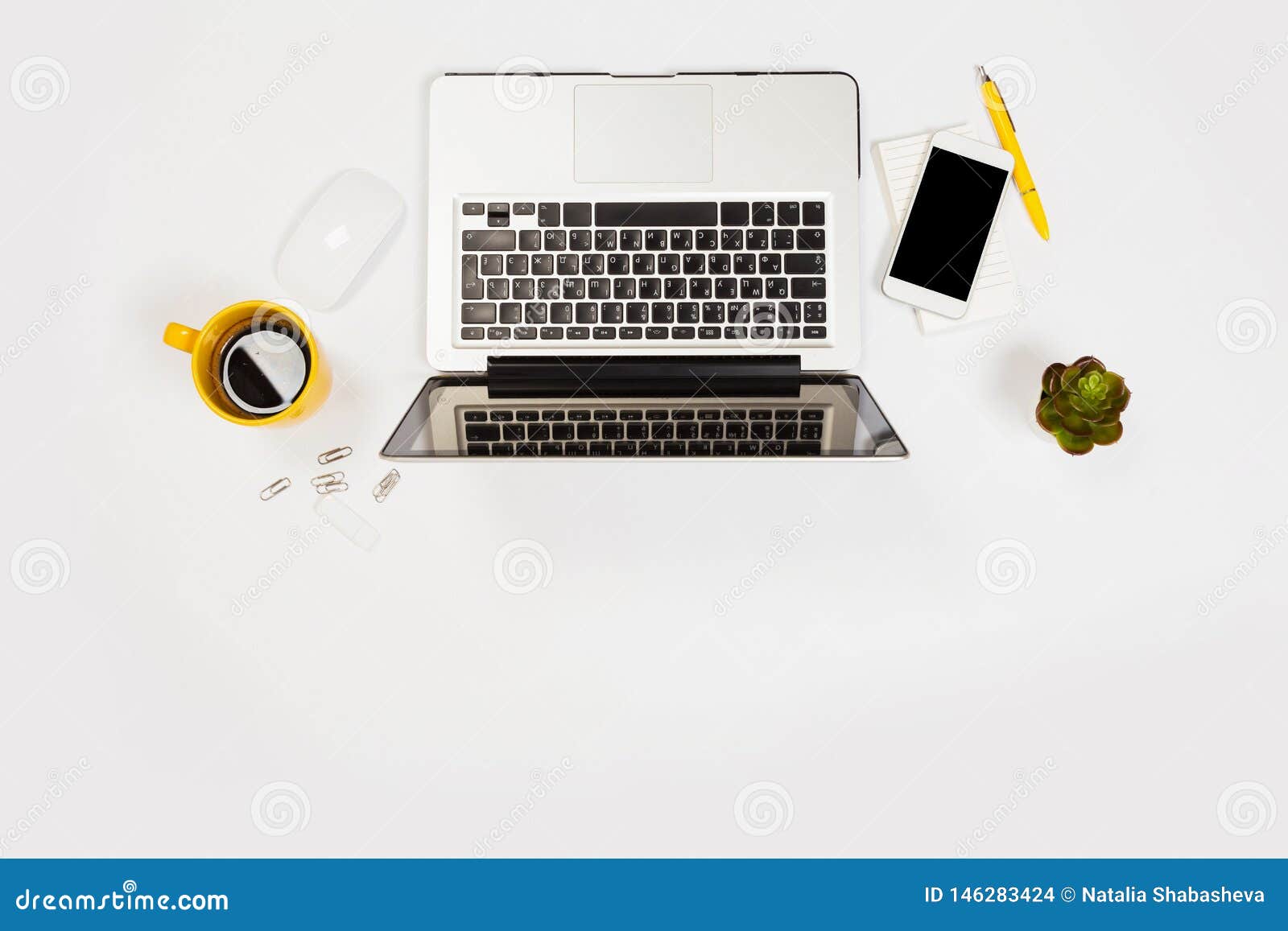 White Office Desk Table With A Lot Of Things On It Top View With