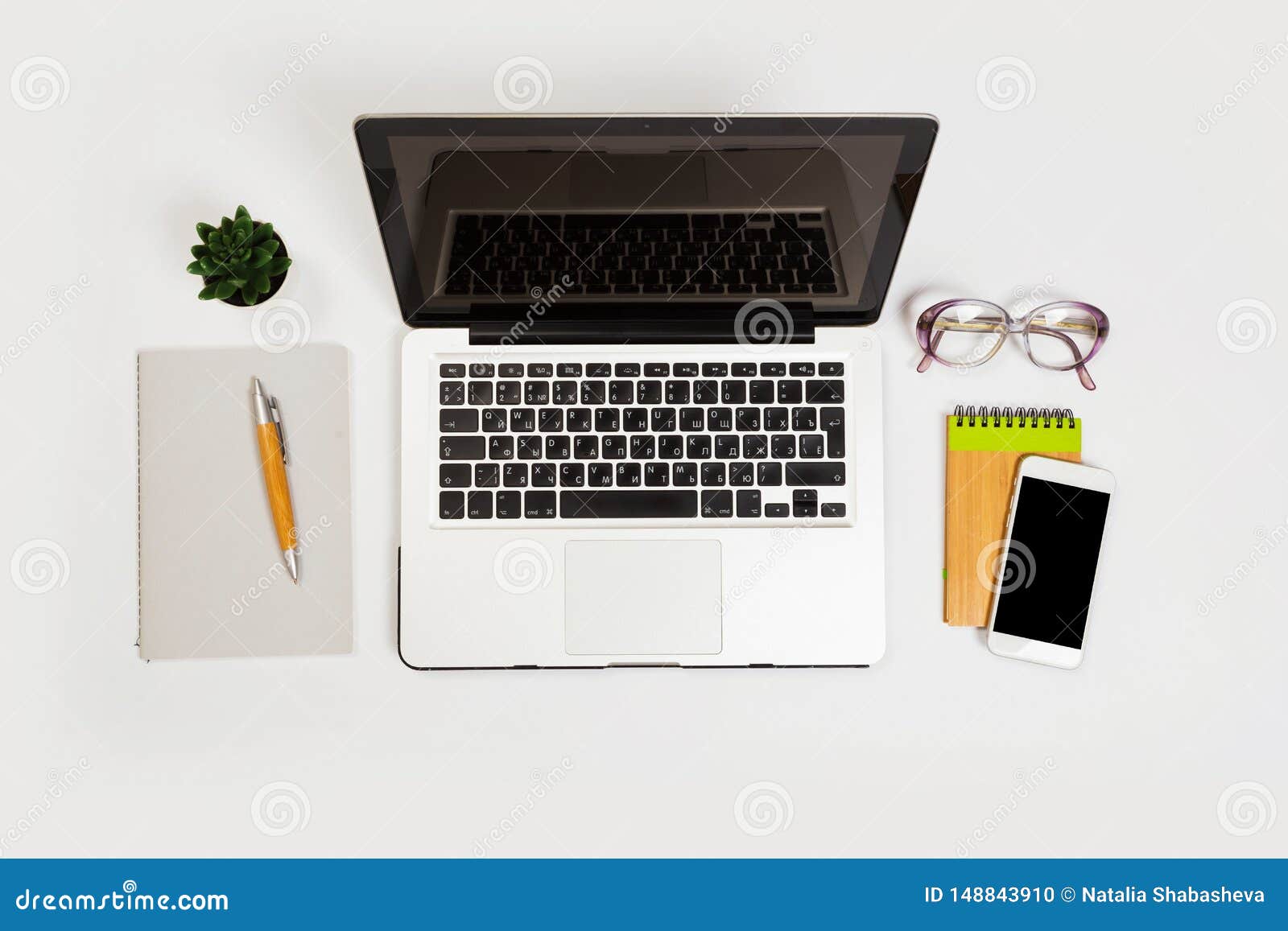White Office Desk Table With A Lot Of Things On It Top View With