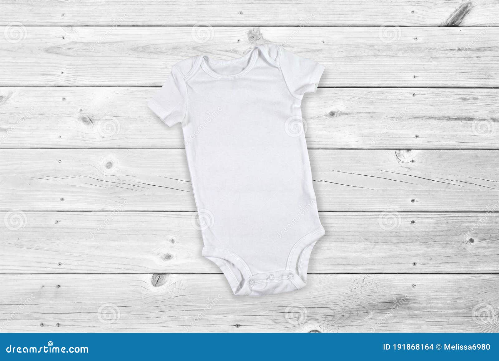 Download White Onesie Mockup On Weathered Wooden Background Stock Photo Image Of Classic Fashion 191868164