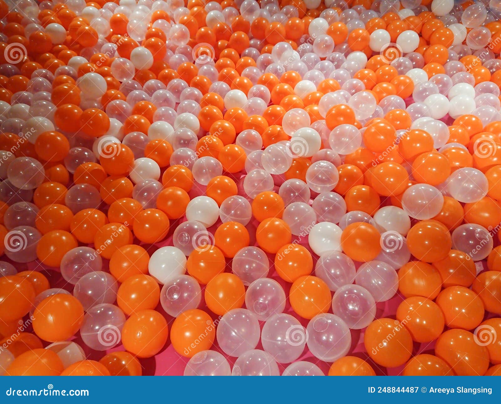 White and Orange Plastic Balls in Playground Stock Image Image of