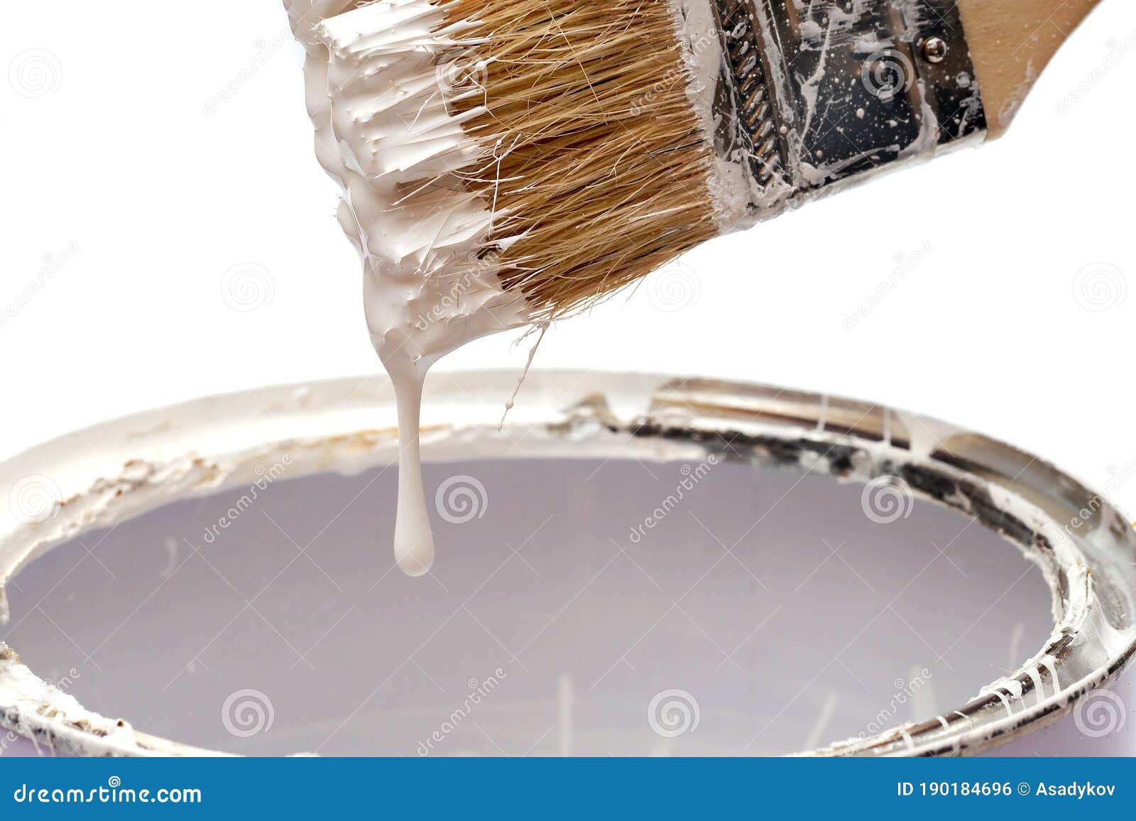 White Paint Dripping from the Brush into a Tin Stock Photo Image of