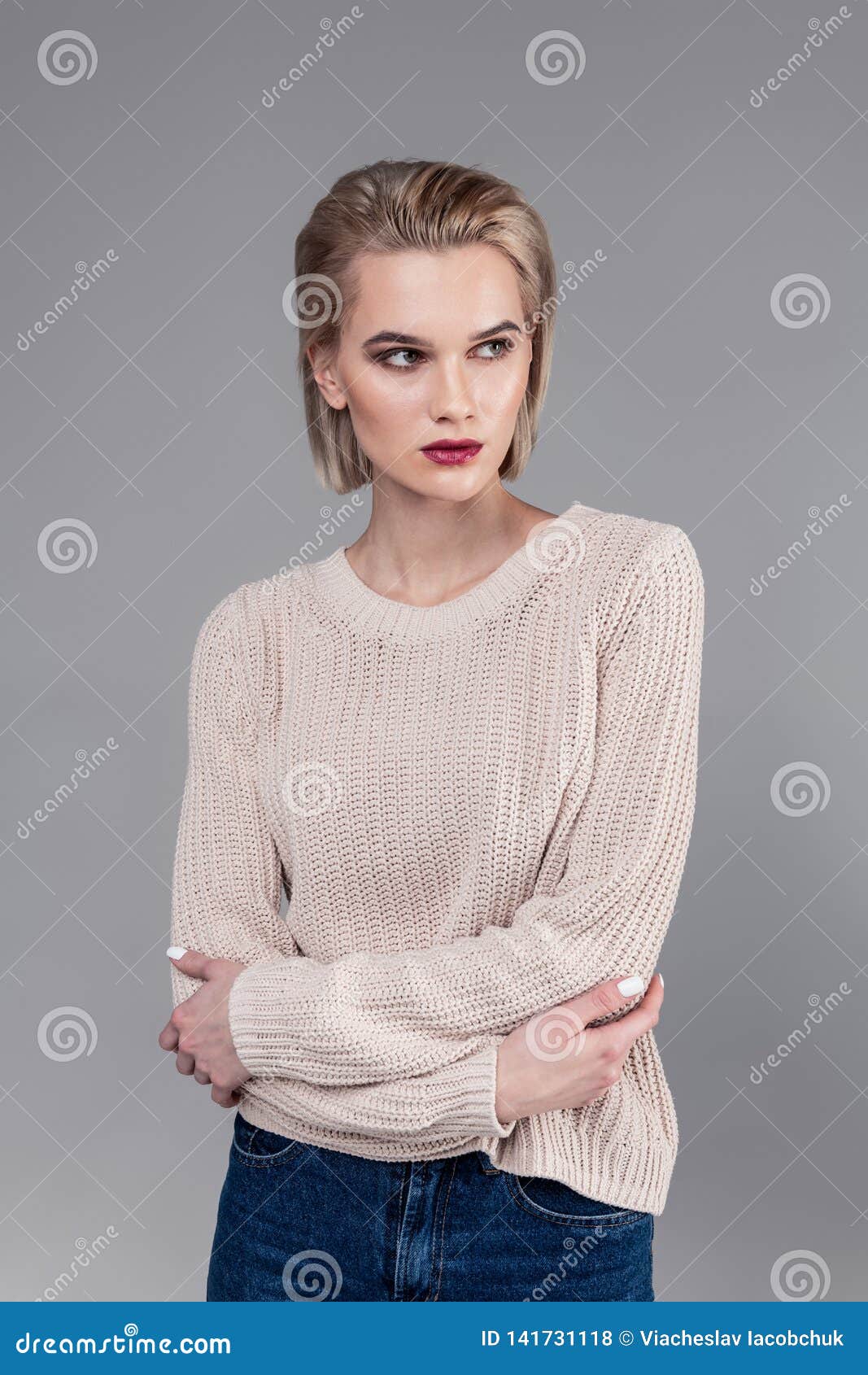 Beautiful Resolute Young Woman Crossing Her Hands while Posing Stock ...