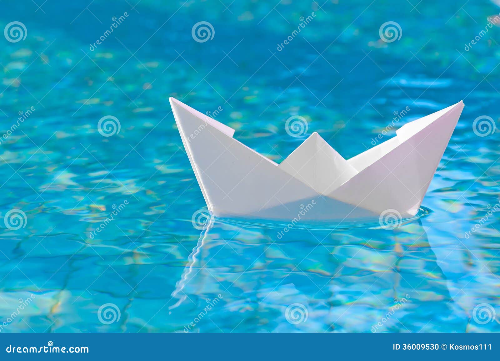 White Paper Boat Floating In The Water Stock Photo - Image 