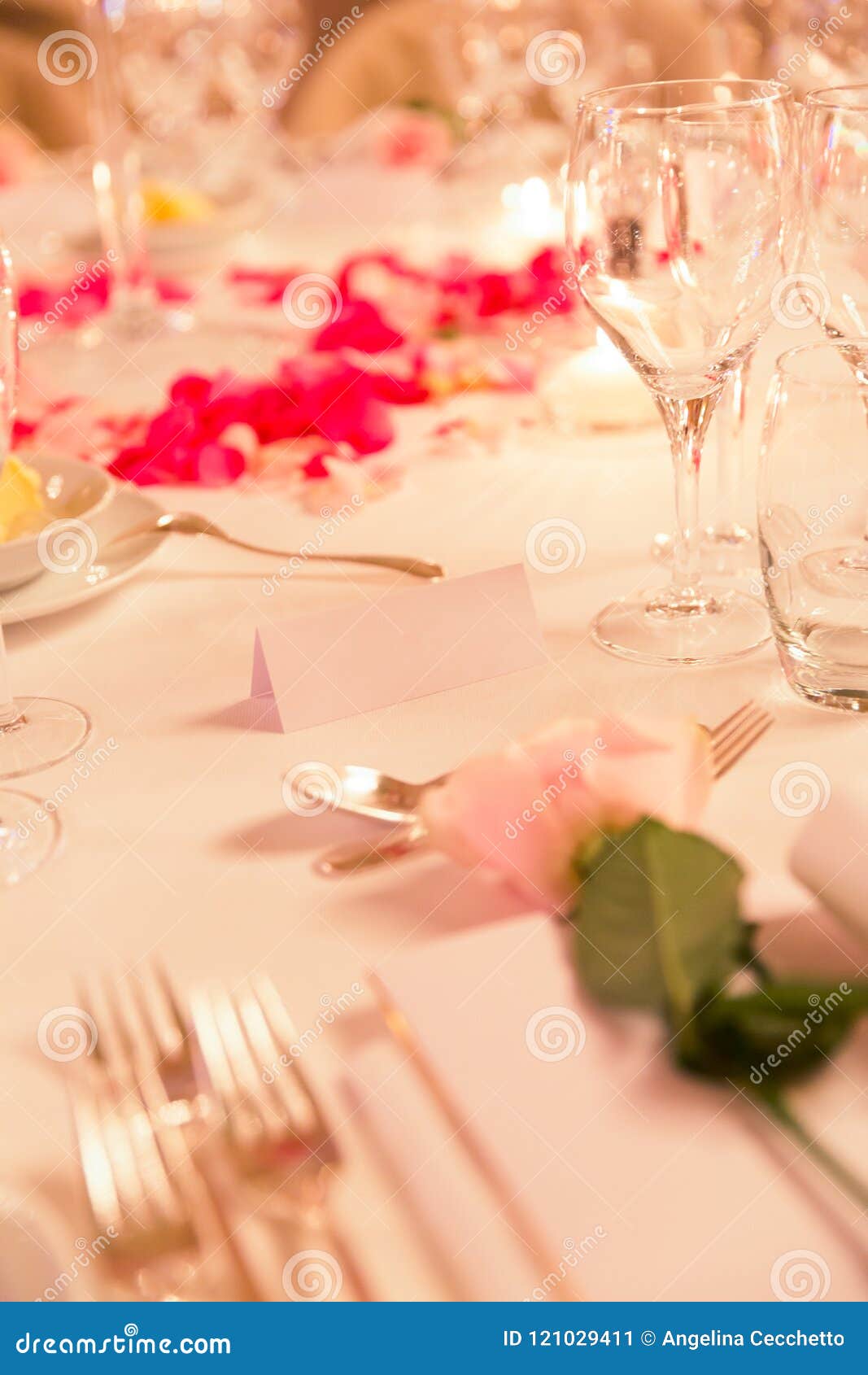 White Name Tag on Flowery Wedding Dinner Table with Silverware Stock