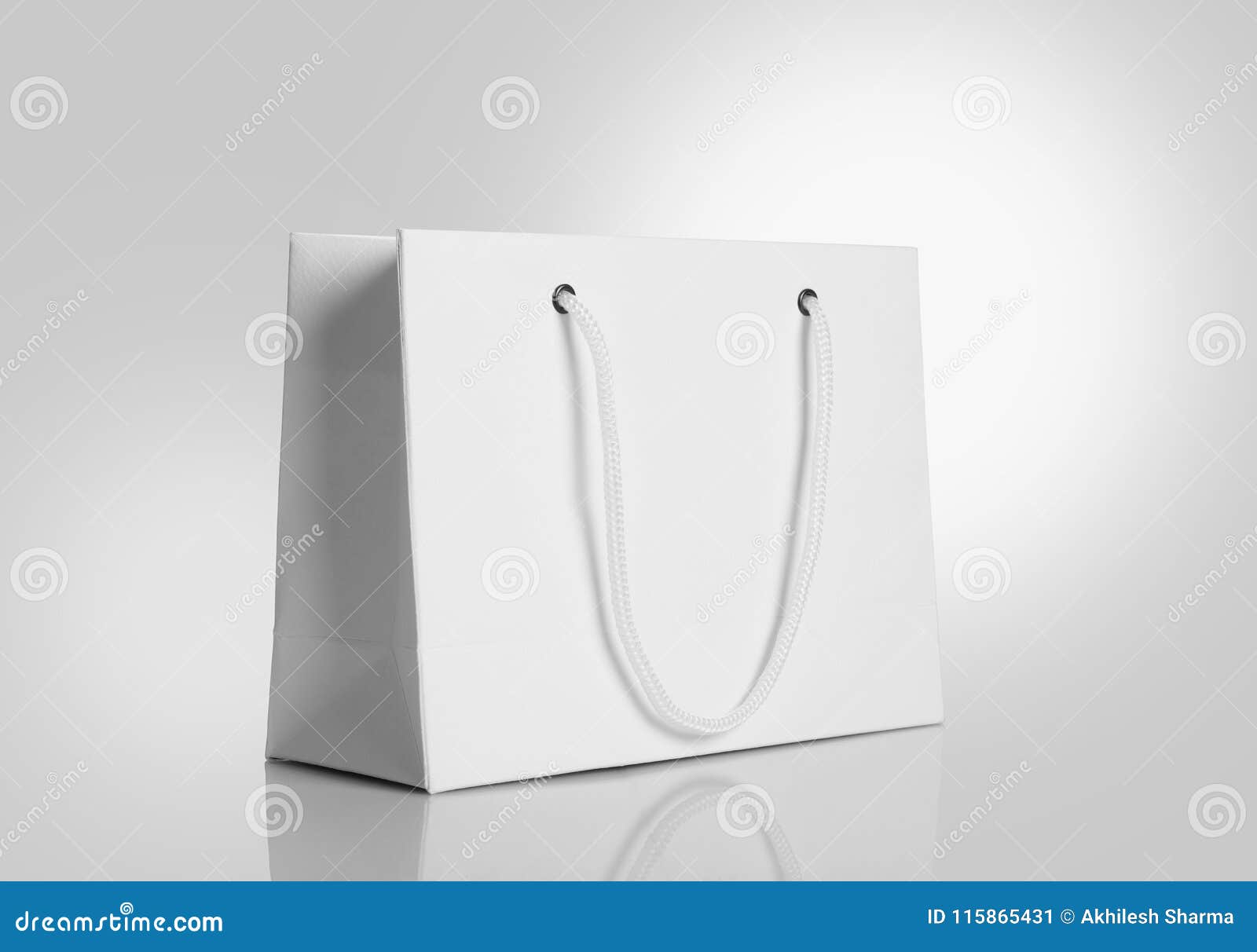 white paper shopping bag on gray background for mockups