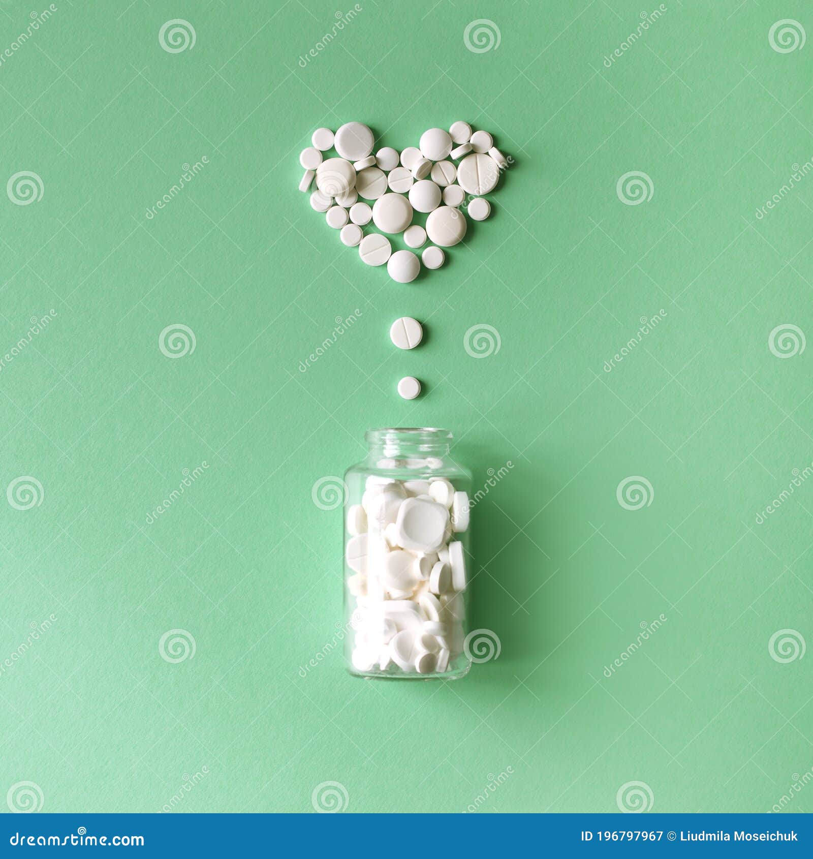 yellow white capsules pills light paper background