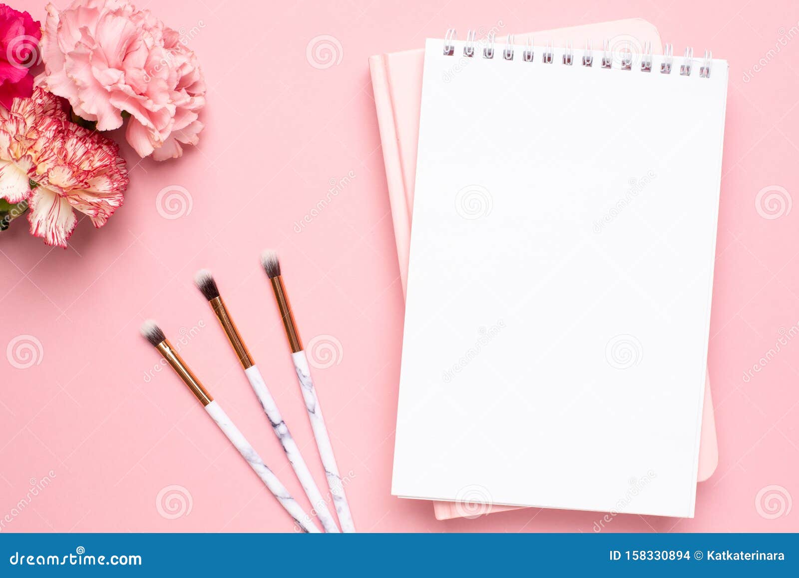 White and Pink Notebook with Carnation Flower and Make Up Brushes ...