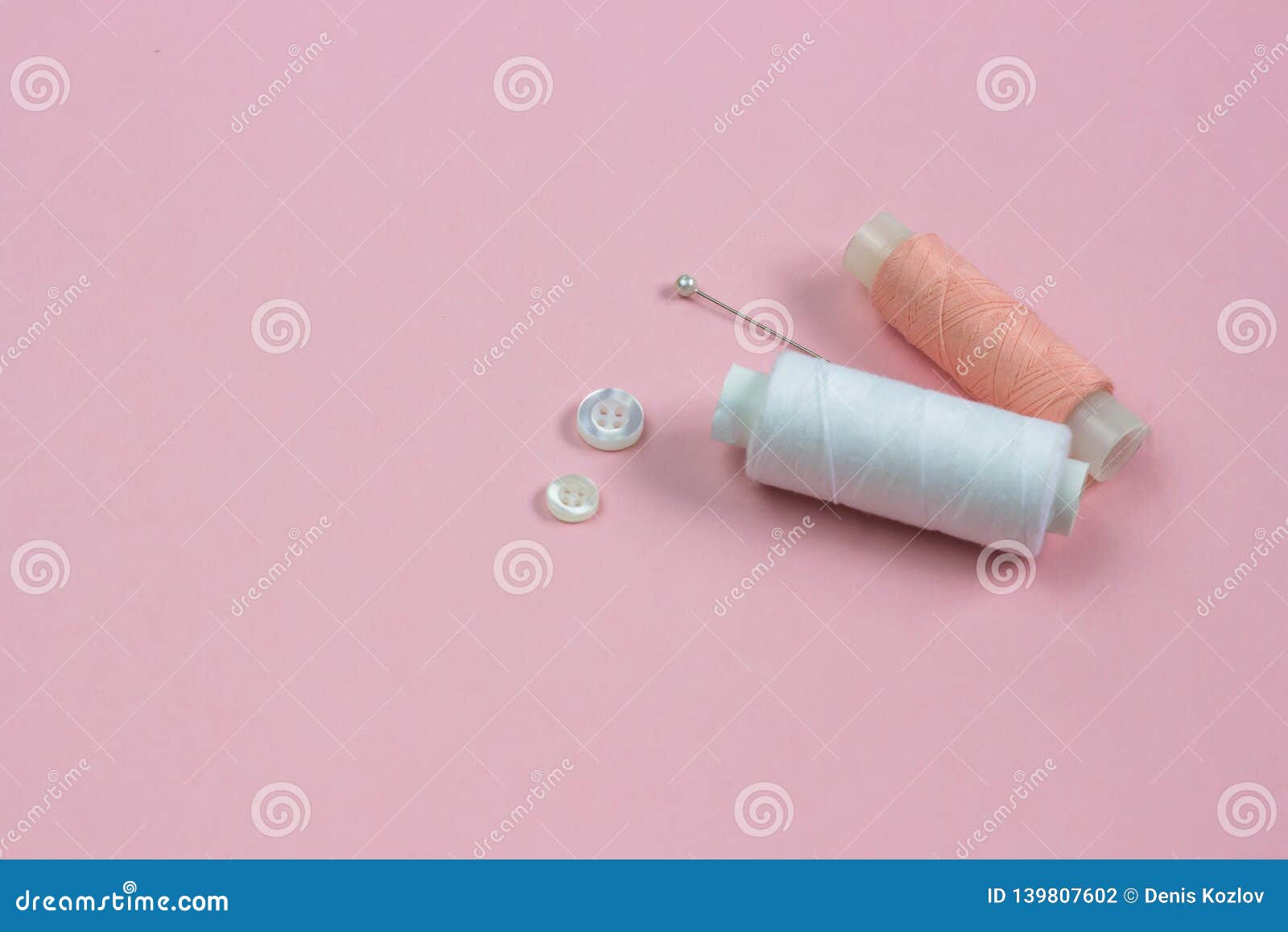 White And Pink Threads, White Buttons And A Needle Stock Photo - Image ...