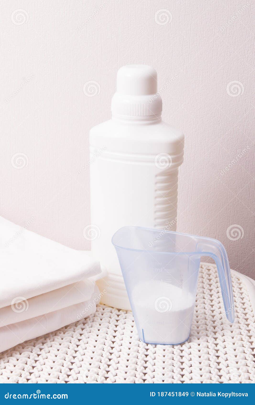 White Plastic Bottle with Bleach and Laundry Detergent in a Measuring Cup  on a White Plastic Basket Stock Image - Image of good, advertising:  187451849