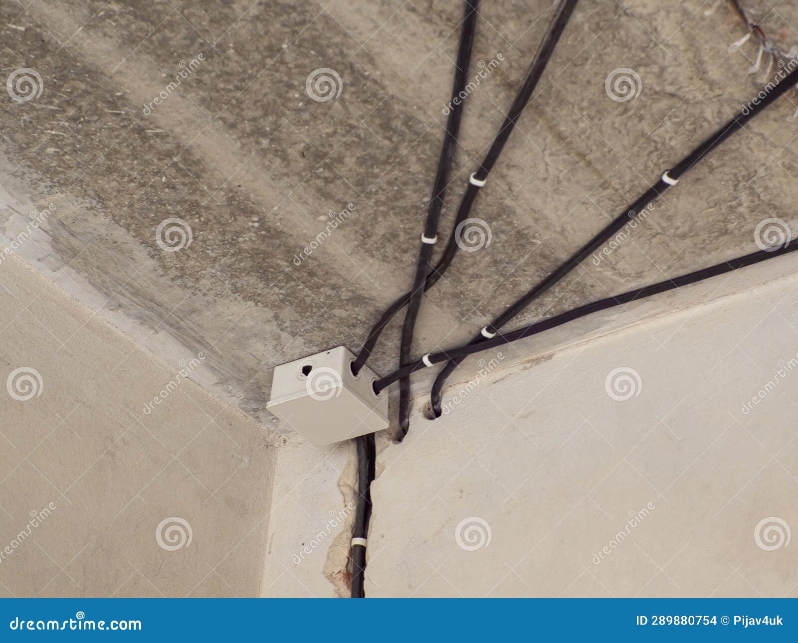 White Plastic Electric Junction Box with Conduits Install in House