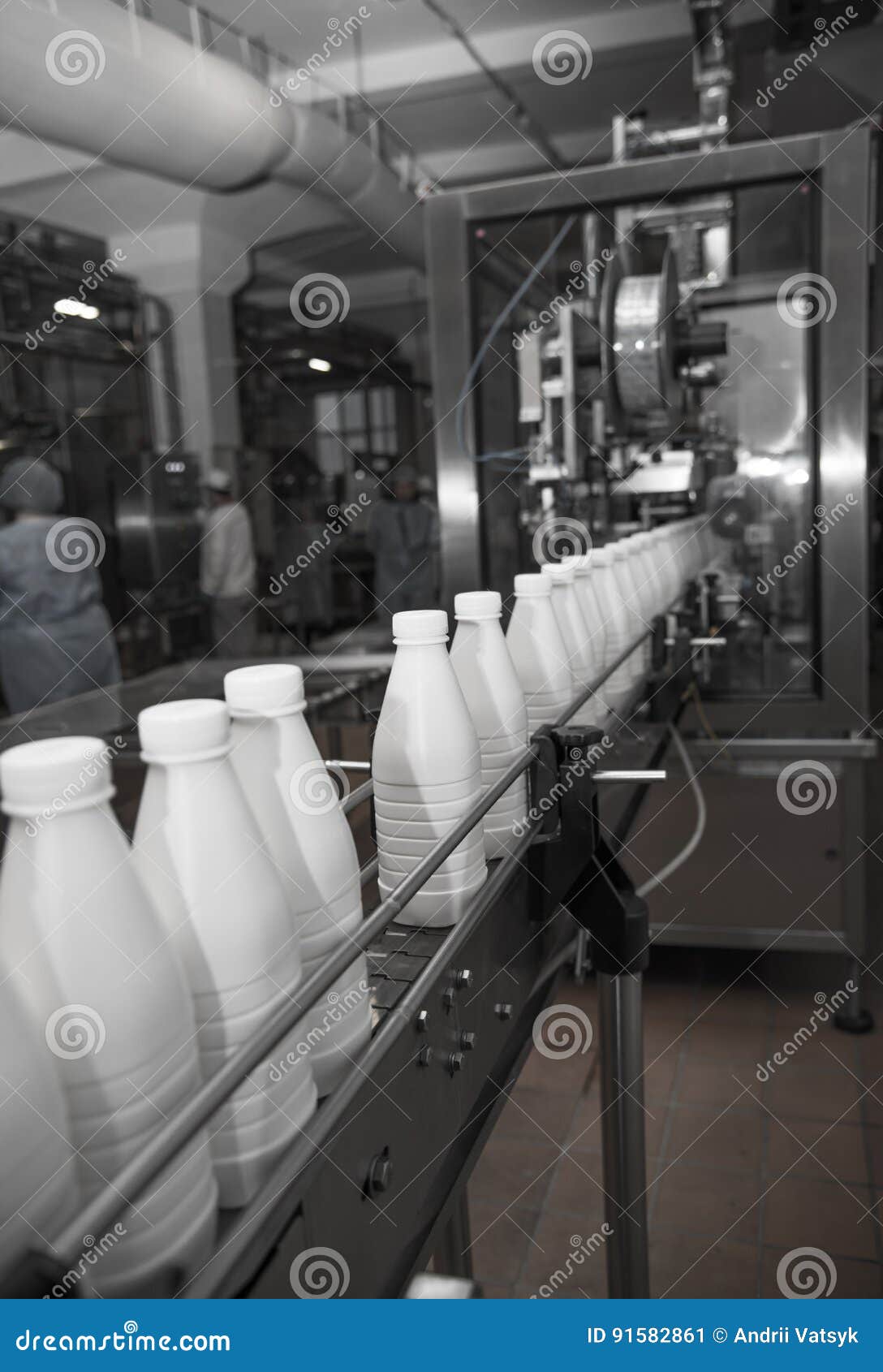White Plastic Milk Bottles on the Conveyor on a Modern Dairy Plant ...