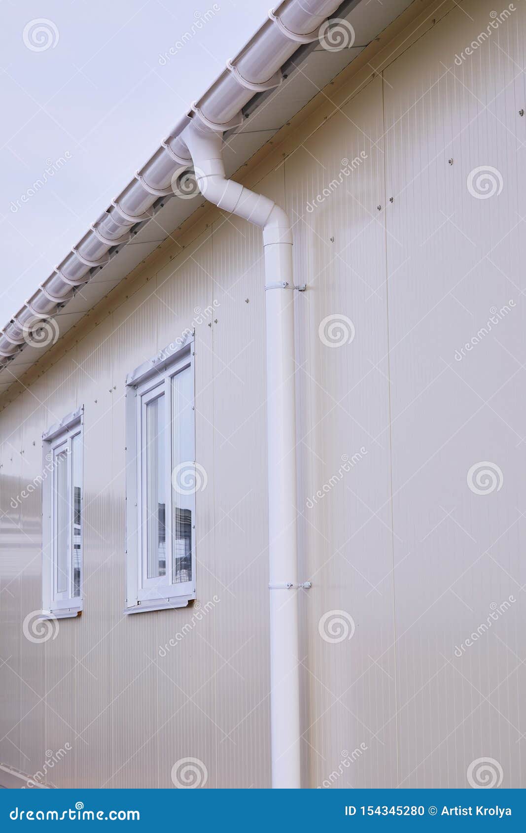 White Plastic Rain Guttering System. Guttering Drainage Pipe Exterior