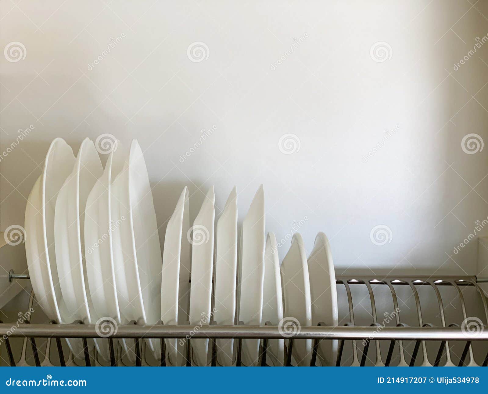 White plates on the dryer stock image. Image of dining 214917207