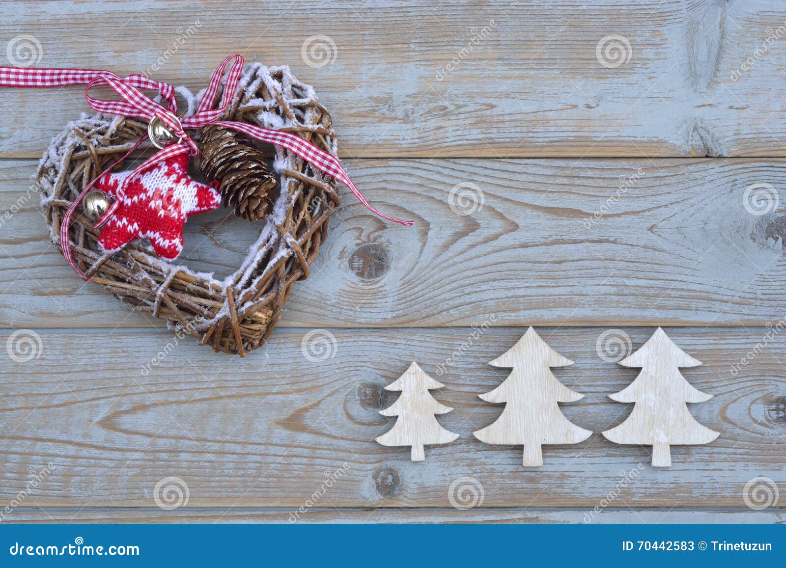 White red christmas decoration as christmas tree reindeer and star on a old grey wooden