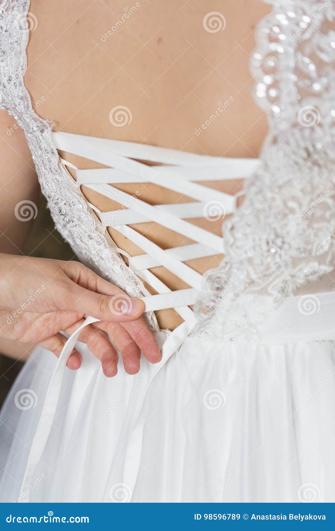 White Ribbon on Lace Wedding Dress, Back of Girl Stock Image