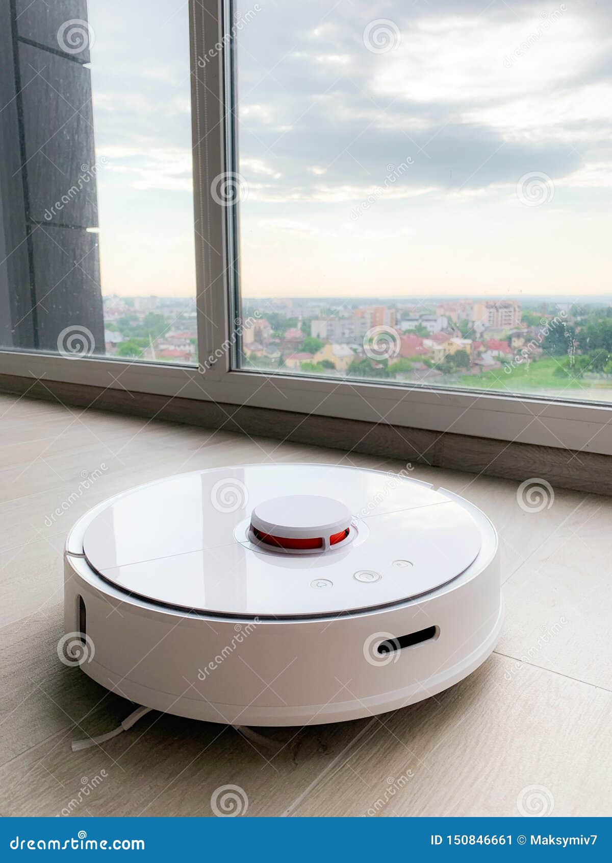 White Robot Cleaner. Robot Vacuum Cleaner on Laminate Floor in Action