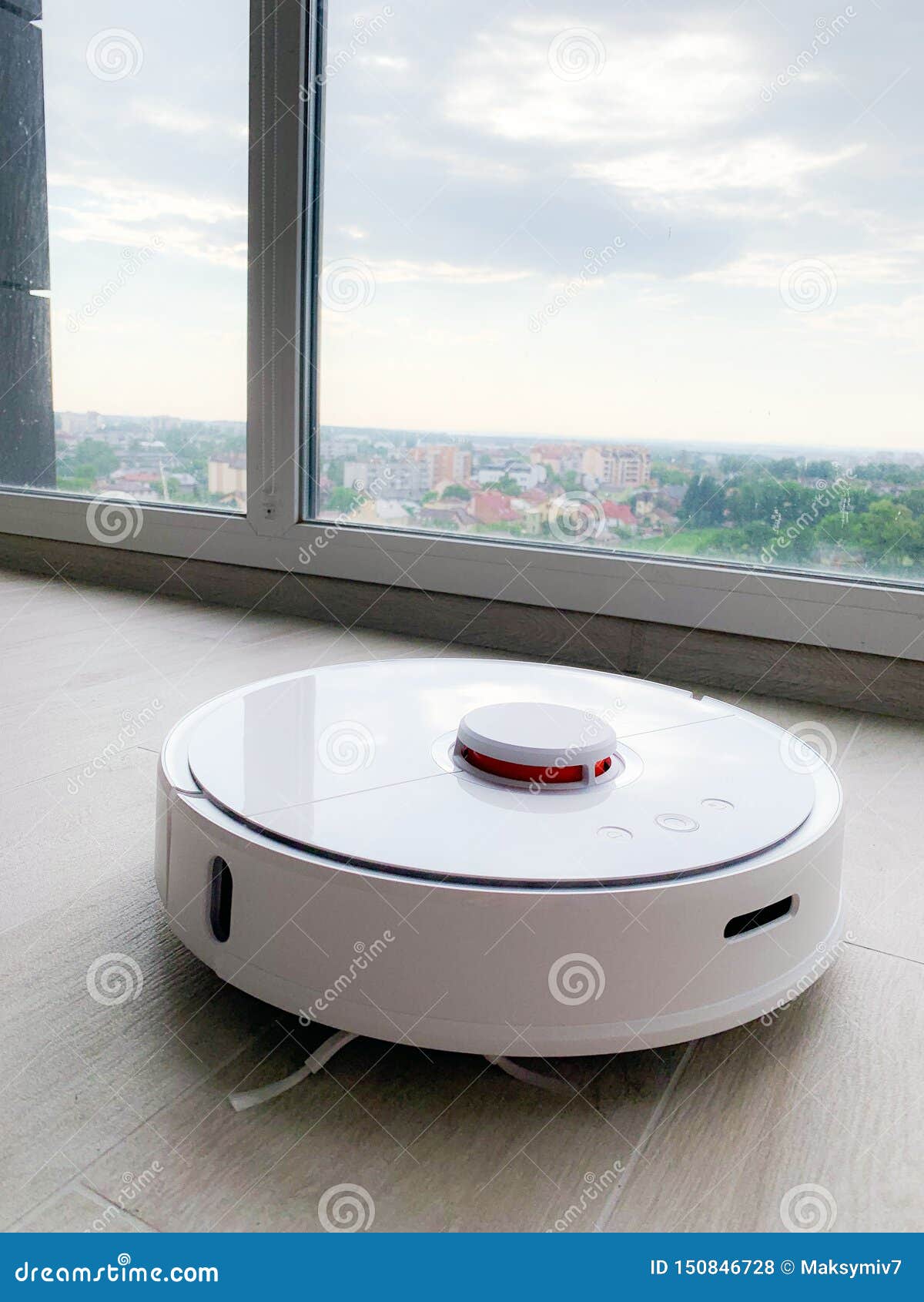 White Robot Cleaner. Robot Vacuum Cleaner on Laminate Floor in Action