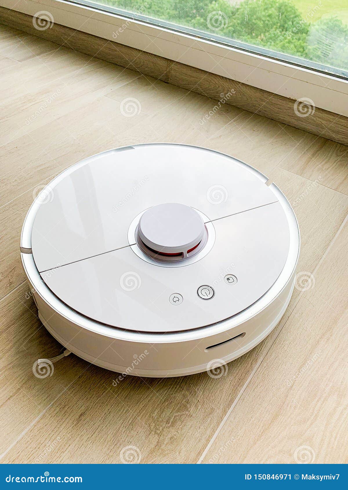 White Robot Cleaner. Robot Vacuum Cleaner on Laminate Floor in Action