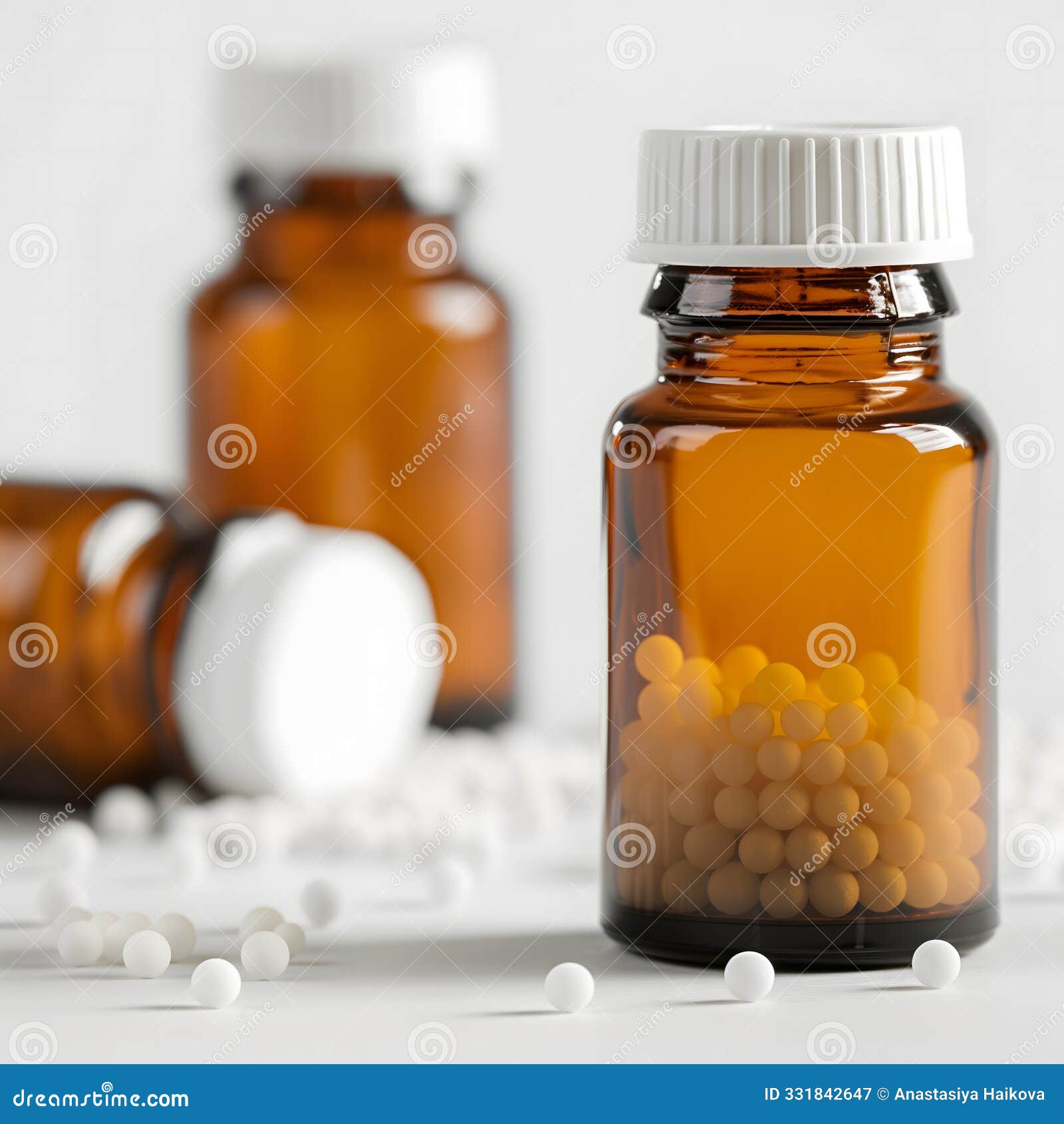 white round granules in glass brown jars, alternative medicine, homeopathy concept, copy space for text