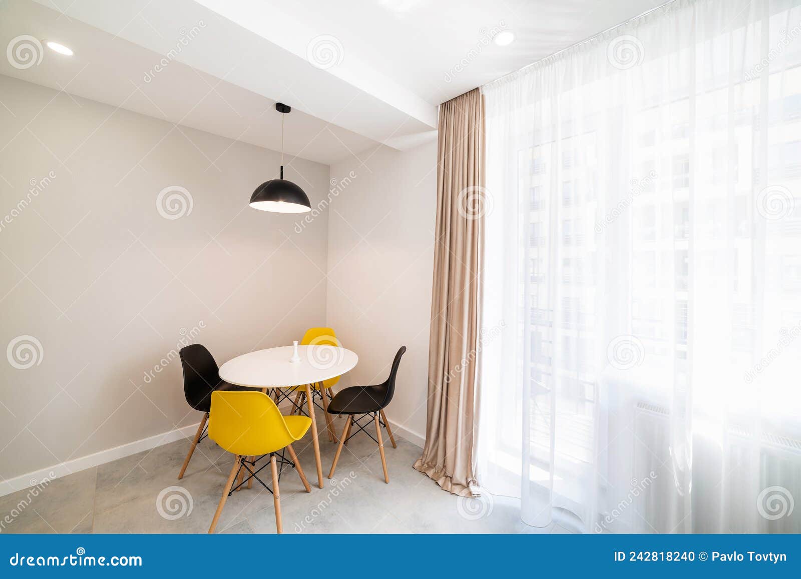 White Round Kitchen Table with Chairs in the Kitchen Stock Photo