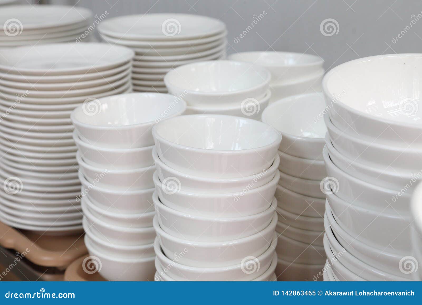 White Set of Ceramic Plate, Dish, Cup Stacking Up the Rack for Kitchen