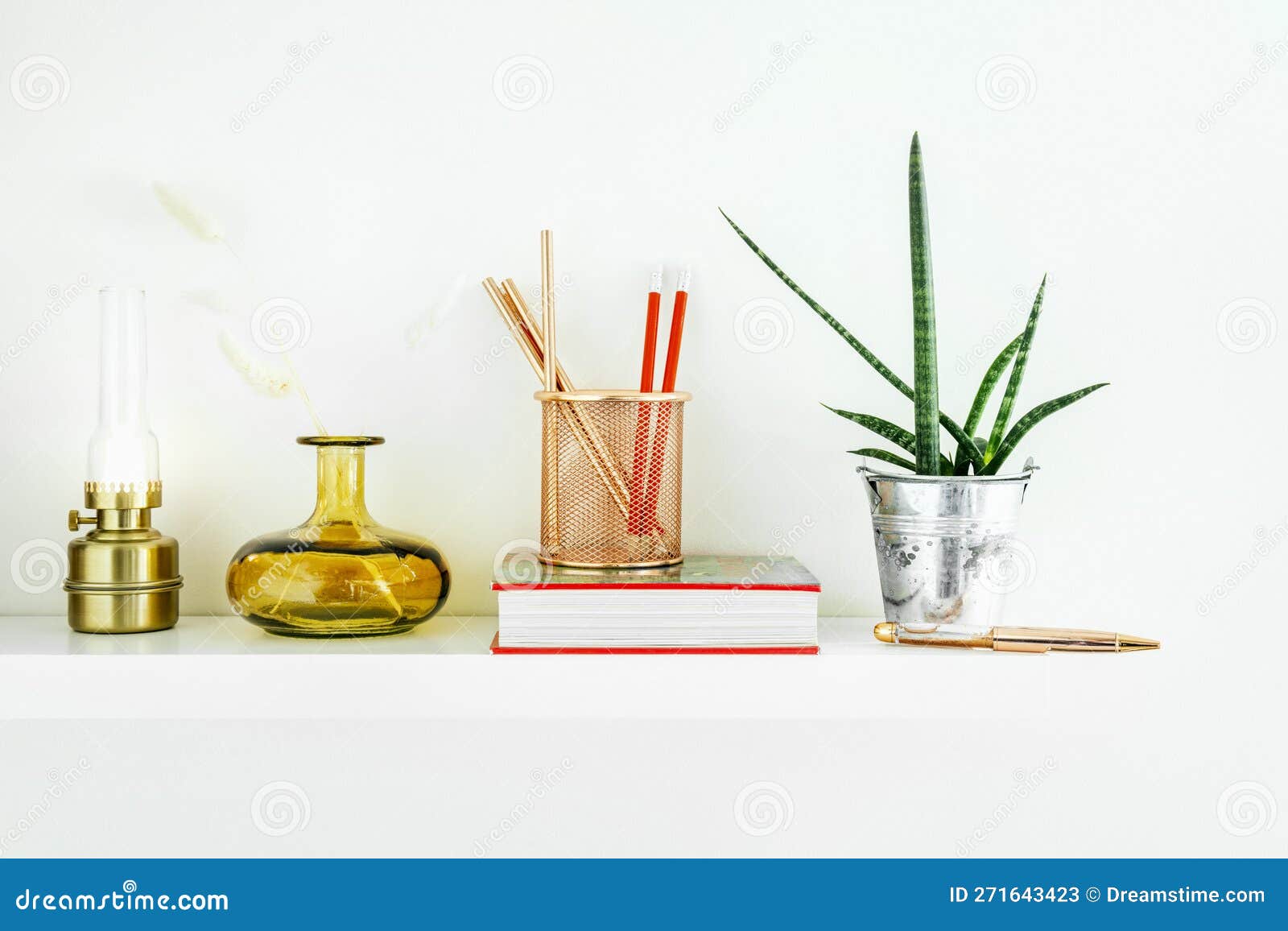 White Shelf with Decorative Objects and Indoor Plants Stock Image