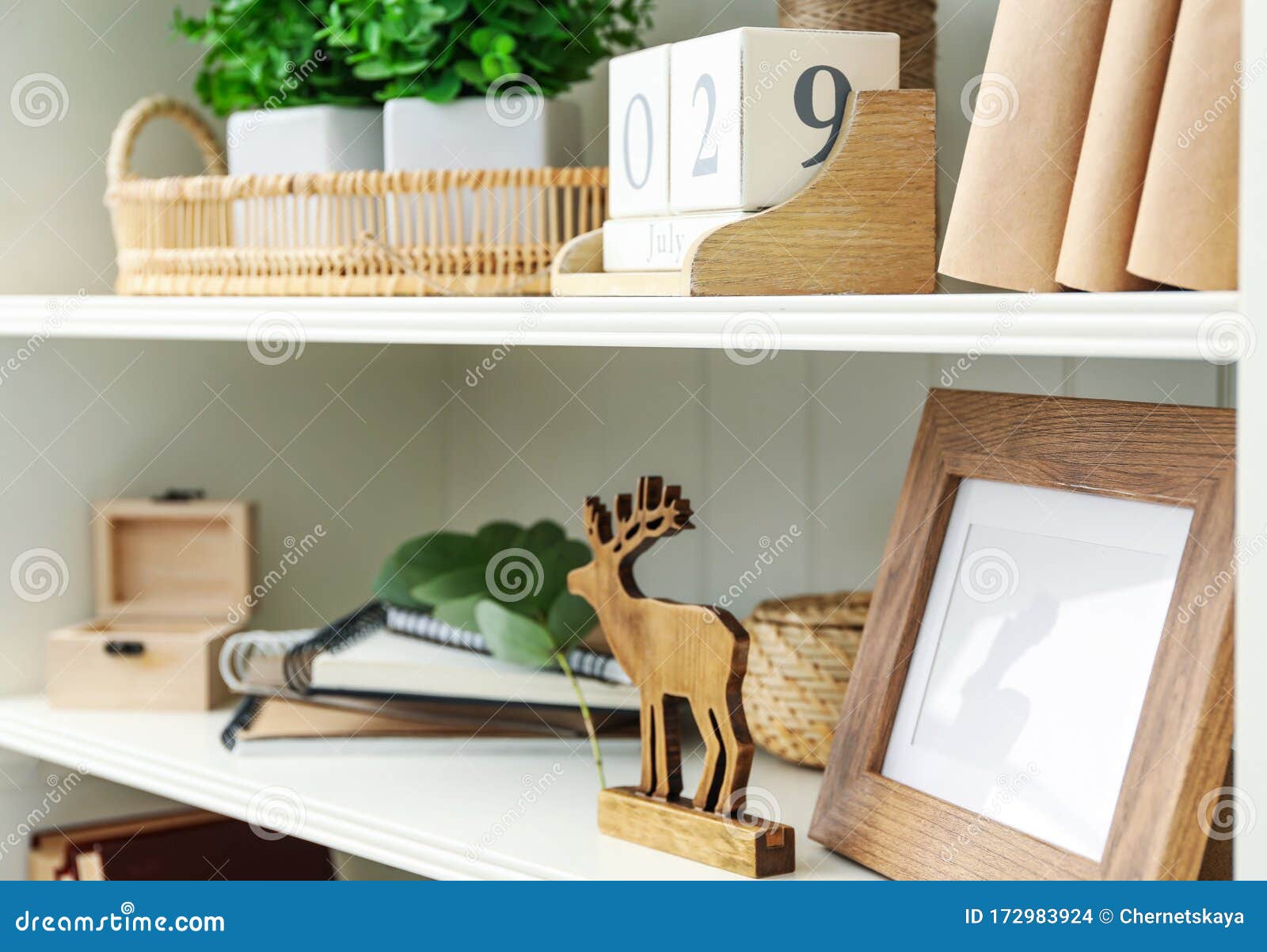 White Shelving Unit with Different Decorative Elements Stock Photo
