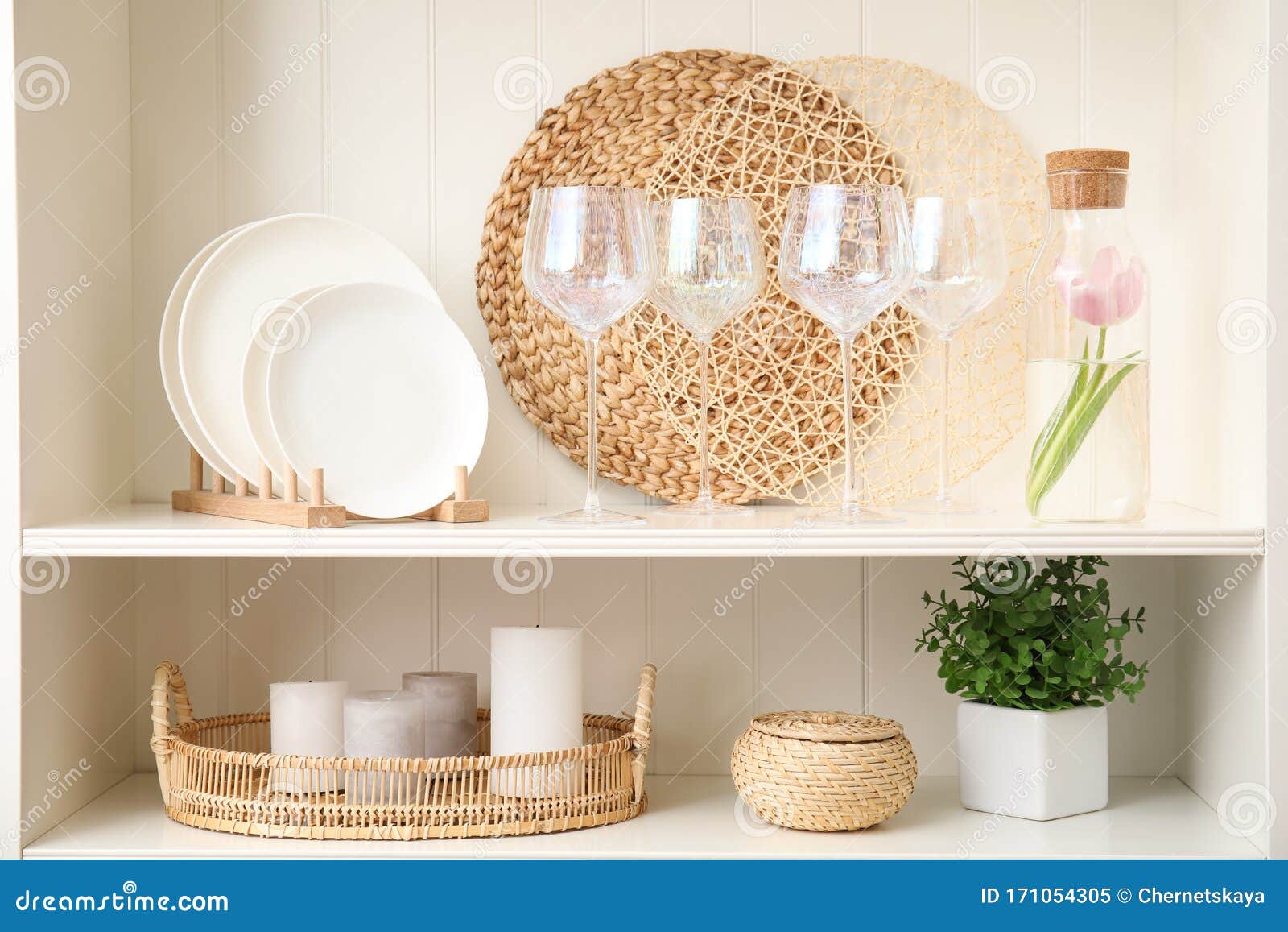 White Shelving Unit with Glasses and Decorative Stuff Stock Image