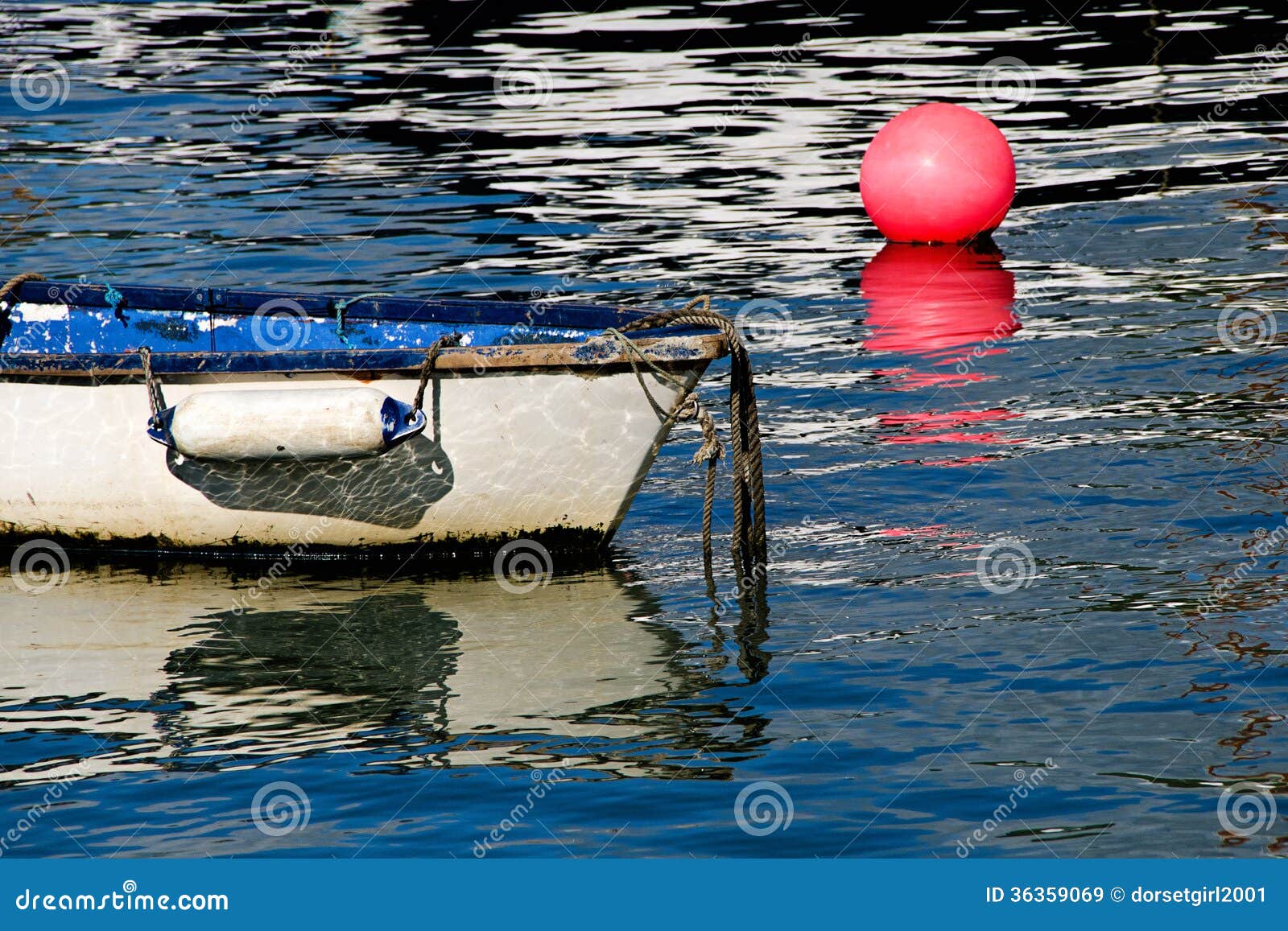 white skiff with pink buoy