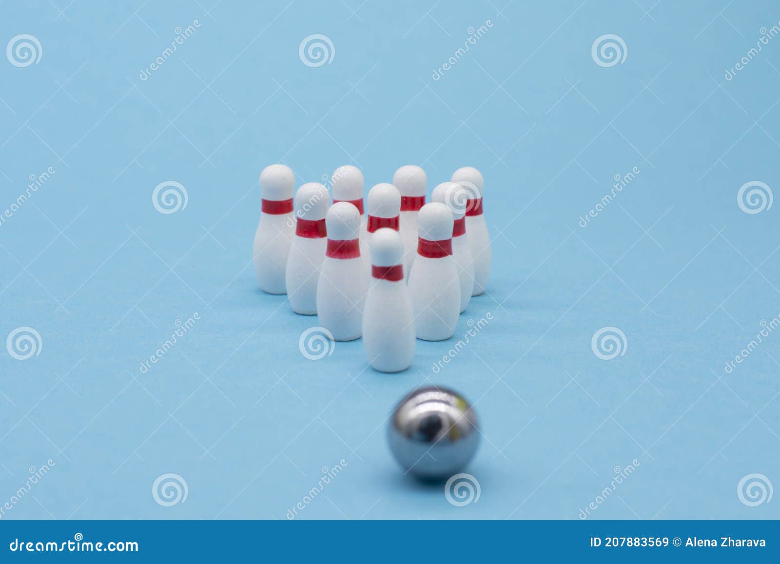 White Small Bowling Pins on a Blue Background.Business Concept Stock