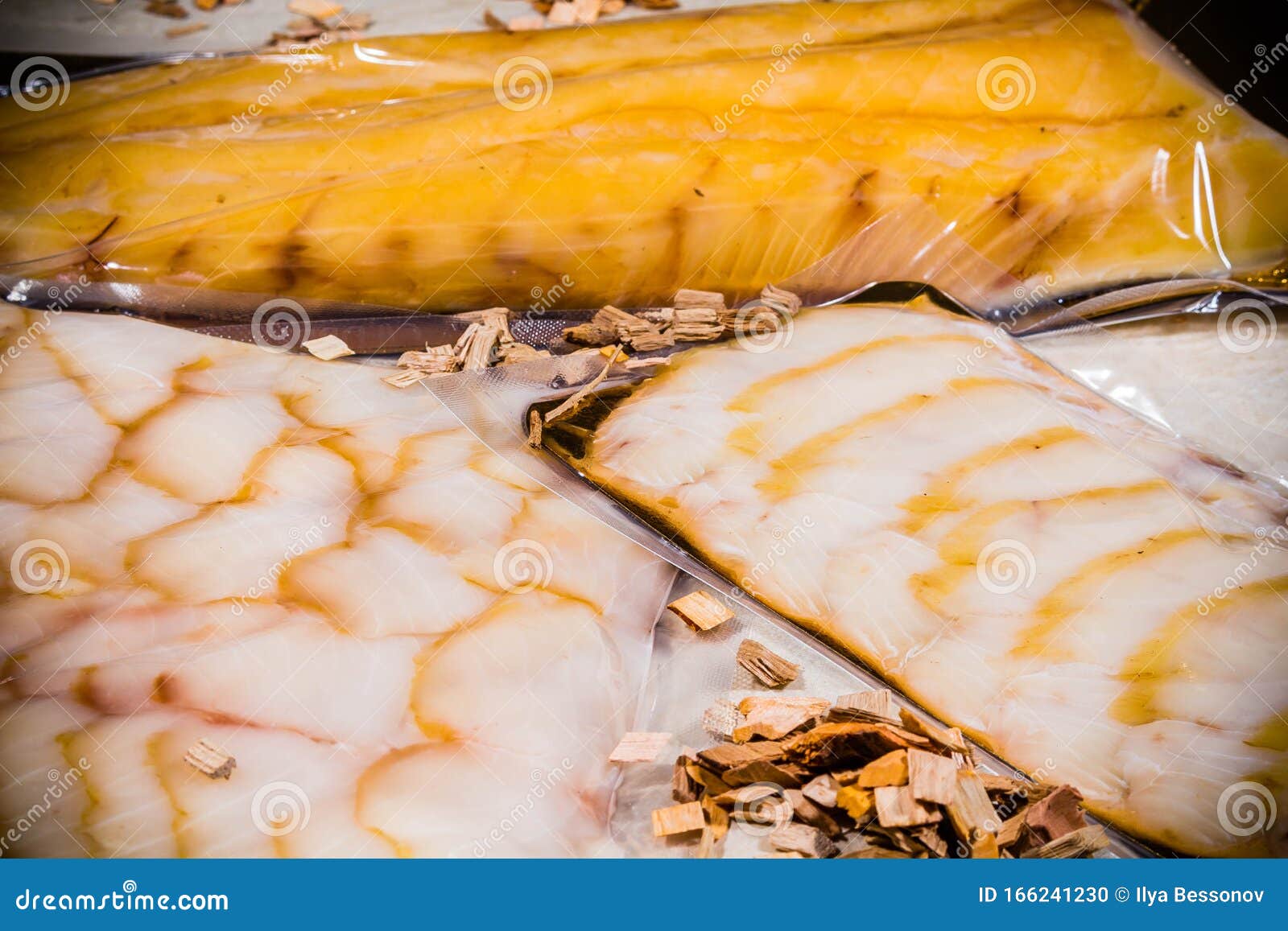 White Smoked Fish in a Sealed Vacuum Package on the Background of a