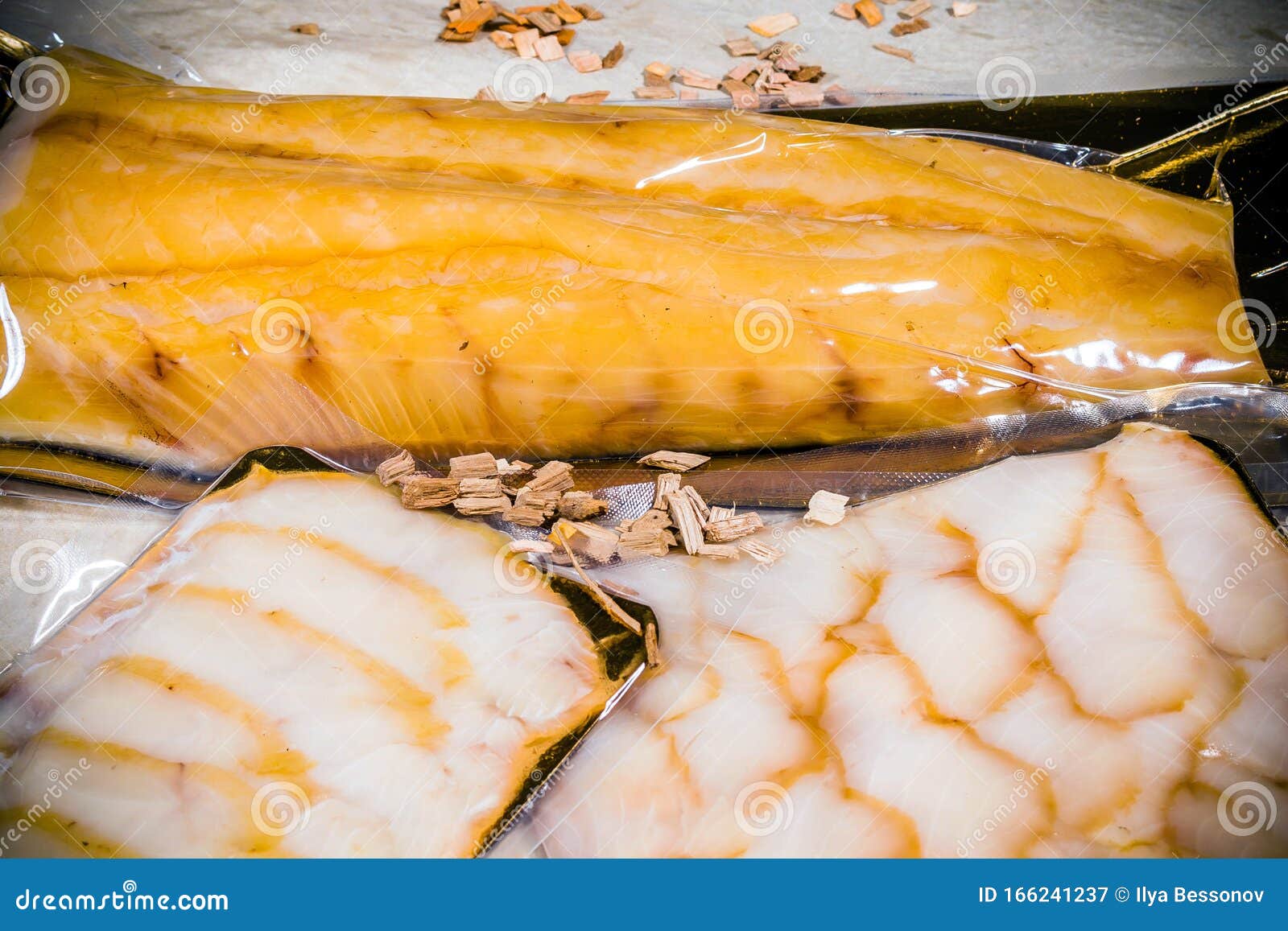 White Smoked Fish In A Sealed Vacuum Package On The Background Of A