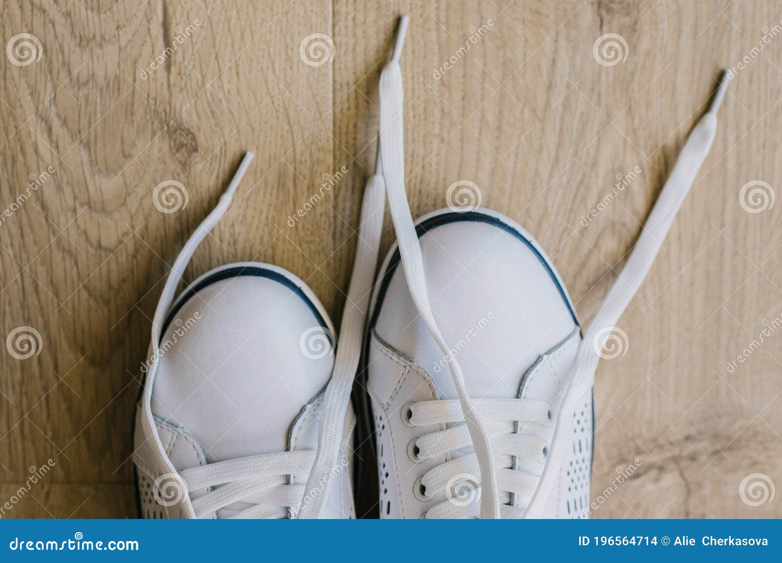 White Sneakers with Untied Laces. Shoes for Sports Stock Photo - Image ...