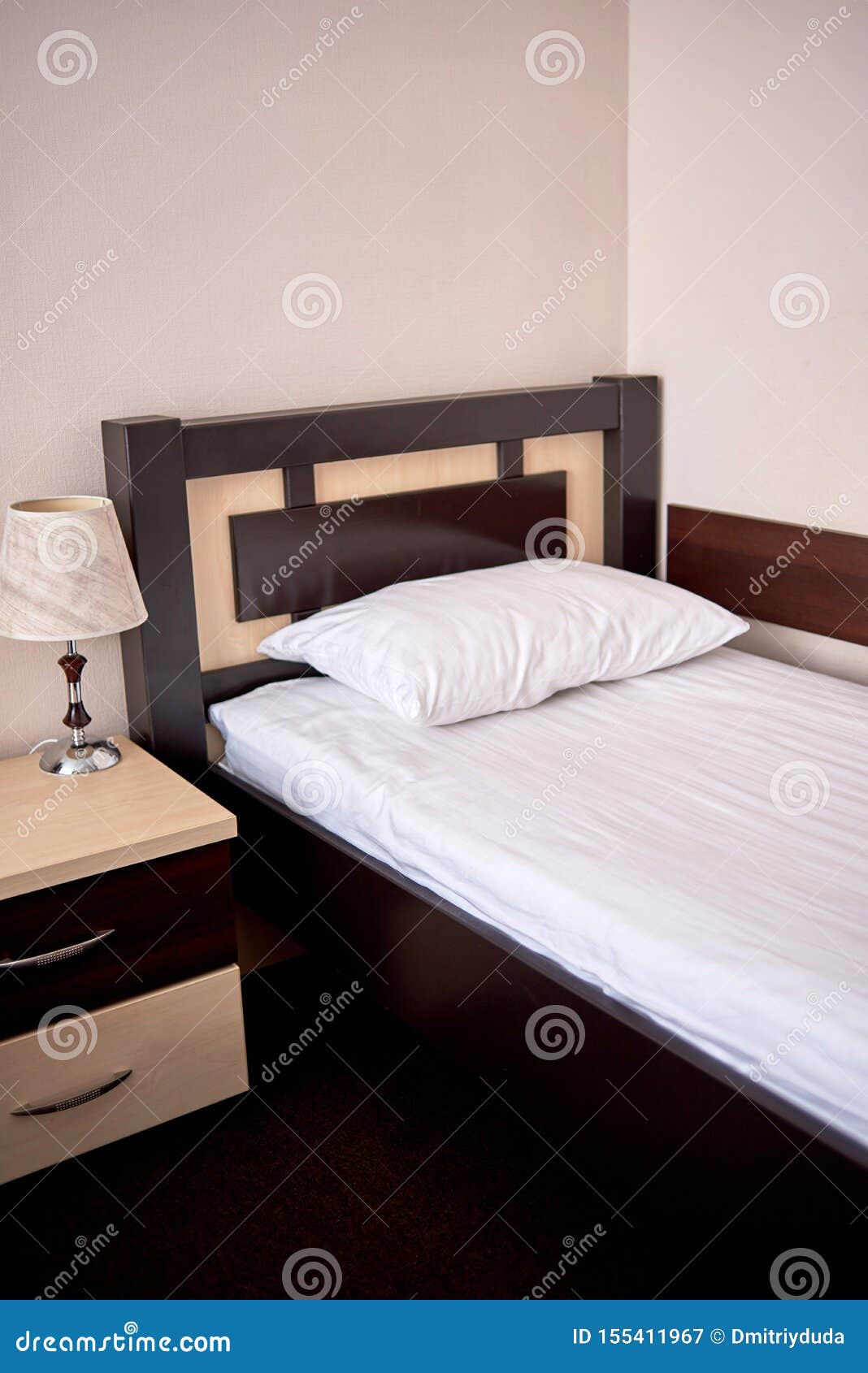 White Soft Pillow on Single Bed with Brown Wooden Headboard in ...