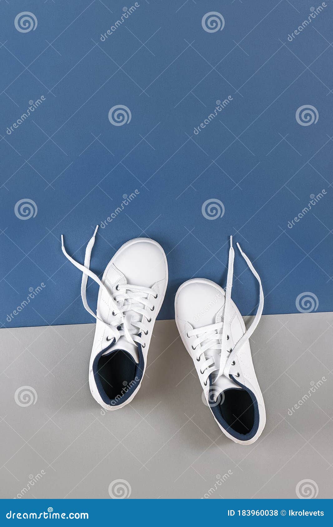 White Sports Shoes, Sneakers with Untied Shoelaces on Grey Blue ...