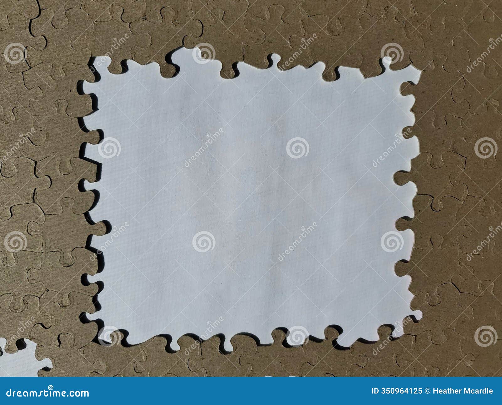 white square ish  inside brown puzzle pieces