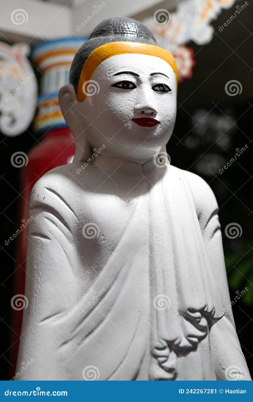 standing gautama buddha at haw par villa, singapore