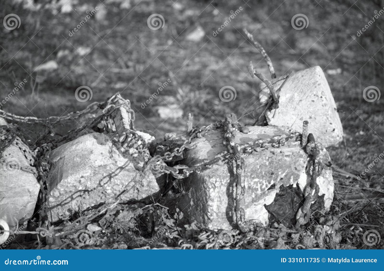 white stone and rocks with boat chain attached