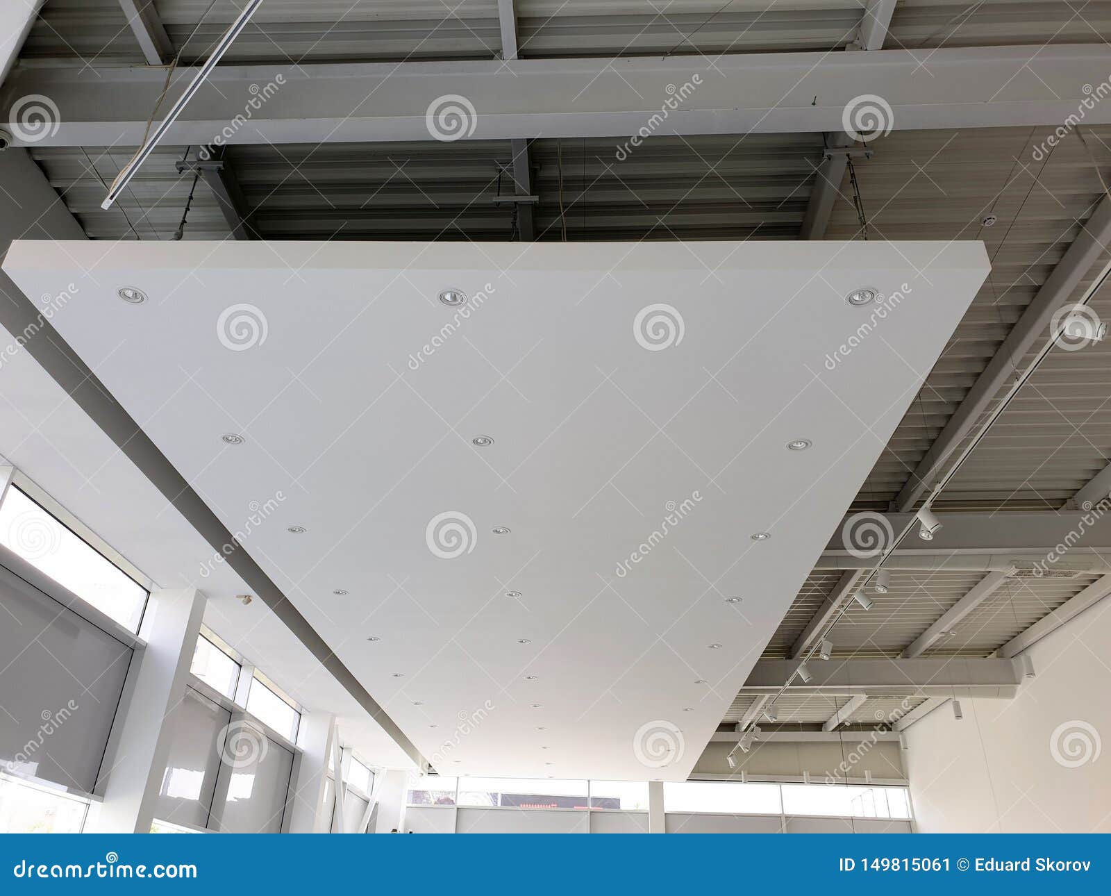 white suspended ceiling with led spotlights. showroom