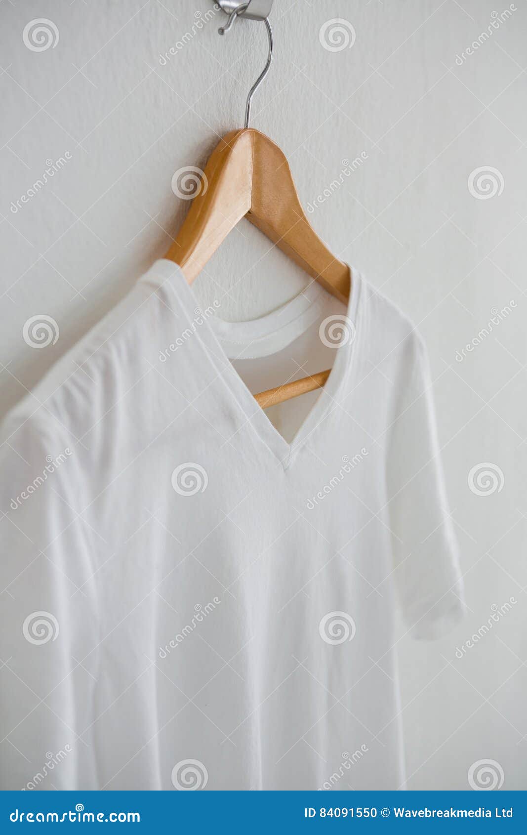 White T-shirt Hanging on Hanger Stock Photo - Image of clothes, cotton ...
