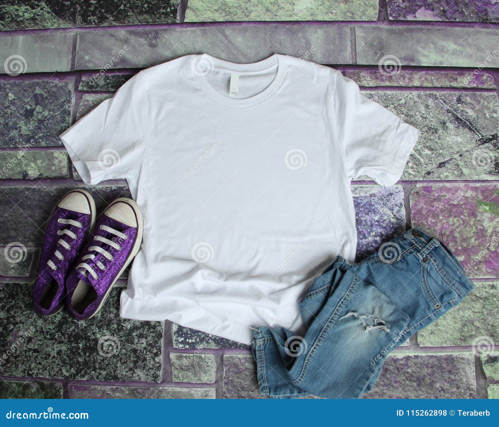 white t shirt mockup flat lay on purple brick background with pu